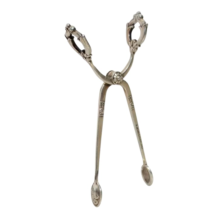 Sterling Silver Sugar Tongs Danish by Cohr Vintage 50s: Danish Modern sterling silver sugar tongs. Beautiful design in the Art Deco/ Danish design theme. Tension spring open and hallmarked Cohr Sterling Denmark to the side. The measurements are 3.75" by