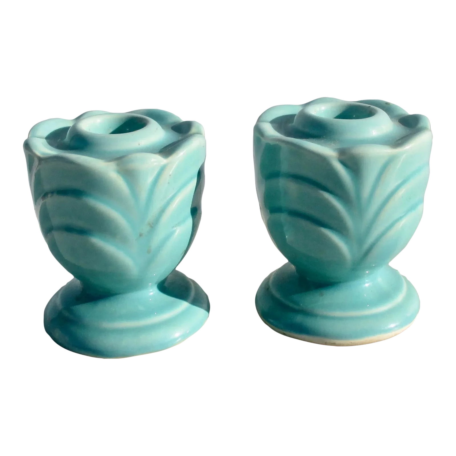 Pair of Art Deco Ceramic Candlesticks- a Pair of 2: Pair of powder blue Art Deco ceramic candlesticks. Classic deco pattern and pale ble color scheme of the 30s. Heavy ceramic cast forms to balance taller candles on the table. The size is 2.75" in
