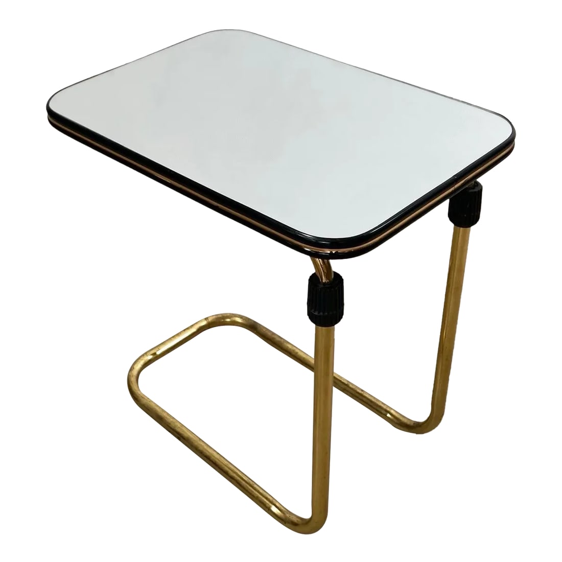 1980's Hollywood Regency Art Deco Brass & Mirror Side Table: Vintage Hollywood Regency end table / drink table for sale. Has an adjustable height, and very unique. It has a cantilever frame in brass, and has a rectangular top with a black and brass trim. It has