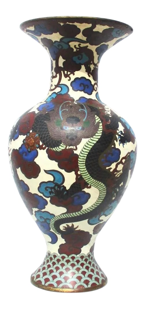 Massive Japanese Enamel Vase Late 19th Century: Massive enamel vase with dragon swirling among blue and brown clouds. White ground body with three black body dragons rising up on the sides. The bottom plate is enameled in flaming jewel medallion