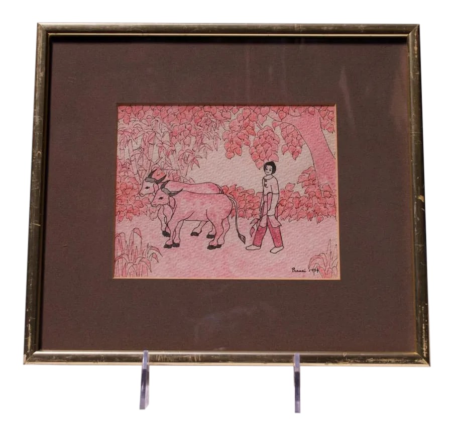 Vintage Southeastern Asian Figural Ink and Watercolor: Ink and watercolor figural drawing of Southeast Asian (Burmese or Thai) rural scene depicting a herder with cows. Signed Pranai 1979. Very good, vintage condition with wear to the frame, as shown. We