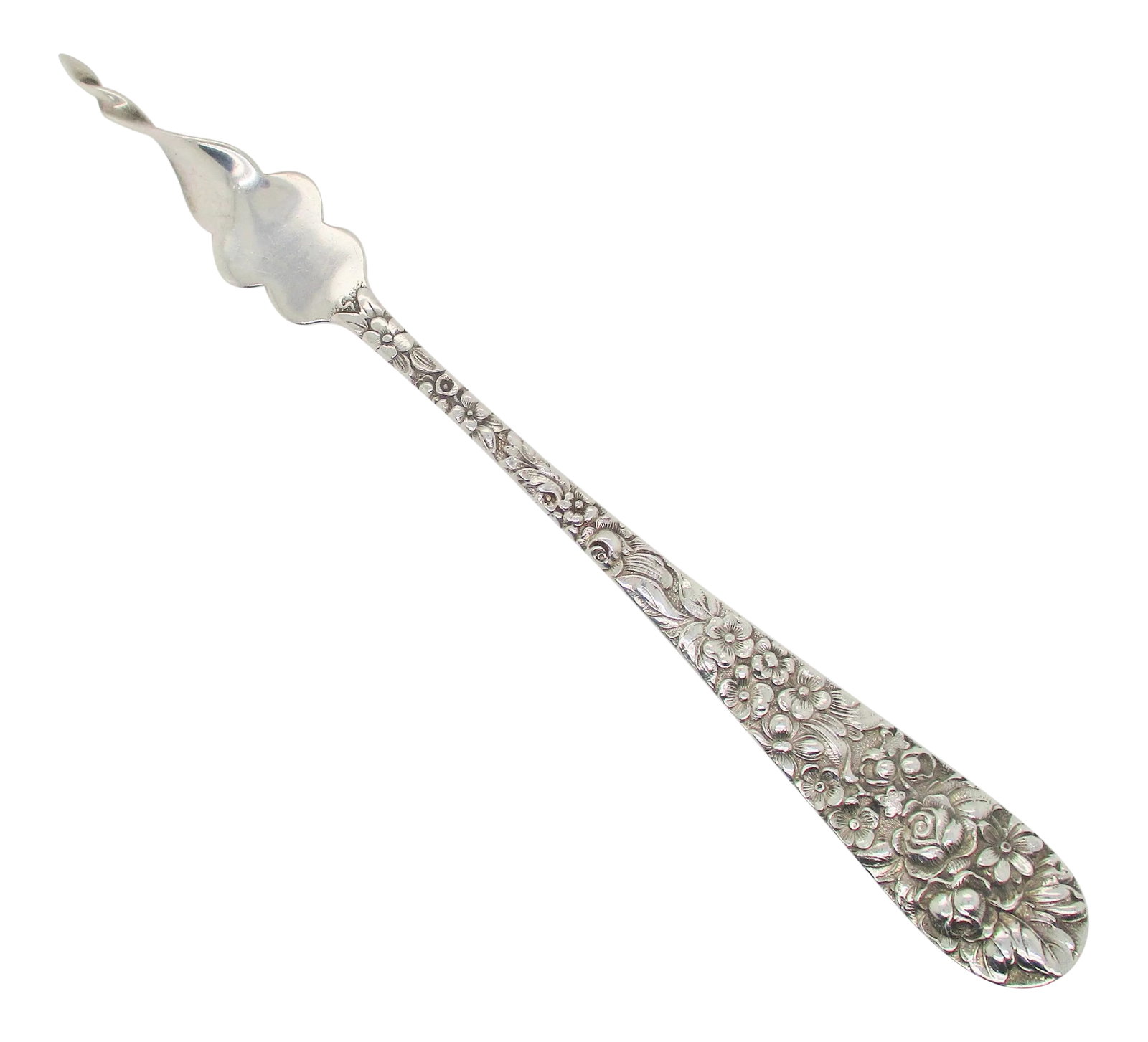Early 20th Century Sterling Silver Butter Pick With Twisted Point: Sterling butter pick with a heavily designed floral handle. Unusual table piece for handling butter curls. Marked sterling Steiff. The size 5.6" long. the condition is very good. Condition:
