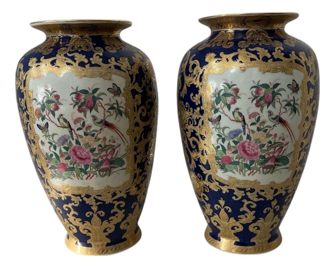 Qianlong Chinese Antique Famille Rose Bird & Floral Design Vase - A Pair: The cobalt blue background with gold gilt filigree pattern sets the tone for this pair of Qianlong Chinese Antique Famille Rose Bird & Floral Design vases. Offered as a pair. Each measures 9"