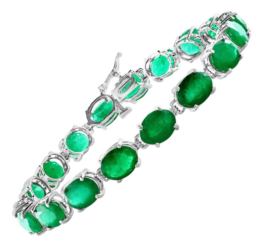 23 Carat Natural Emerald Cocktail Tennis Bracelet 14 Karat White Gold: This exceptionally affordable Tennis bracelet has 17 stones of oval Emeralds . Total weight of the Emeralds is approximately 23 carat. The bracelet is expertly crafted with 12.21 grams of 14 karat