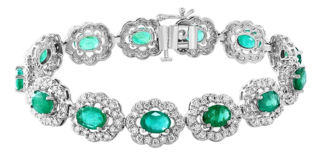 10 Carat Natural Brazilian Emerald & Diamond Tennis Bracelet 14 Karat Gold: 10 Carat Natural Brazilian Emerald & Diamond Tennis Bracelet 14 Karat Gold This exceptionally affordable Tennis bracelet has 13 stones of oval Emeralds . Each Emerald is surrounded by diamonds .