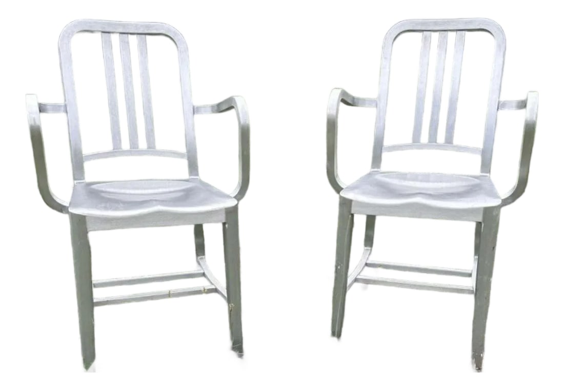 1990s Emeco Brushed Aluminum Armchairs, Pair: A handsome pair of authentic Emeco armchairs in brushed aluminum, dating to the 1990s. With their signature combination of lightness, strength, and crisp industrial lines, these chairs offer the