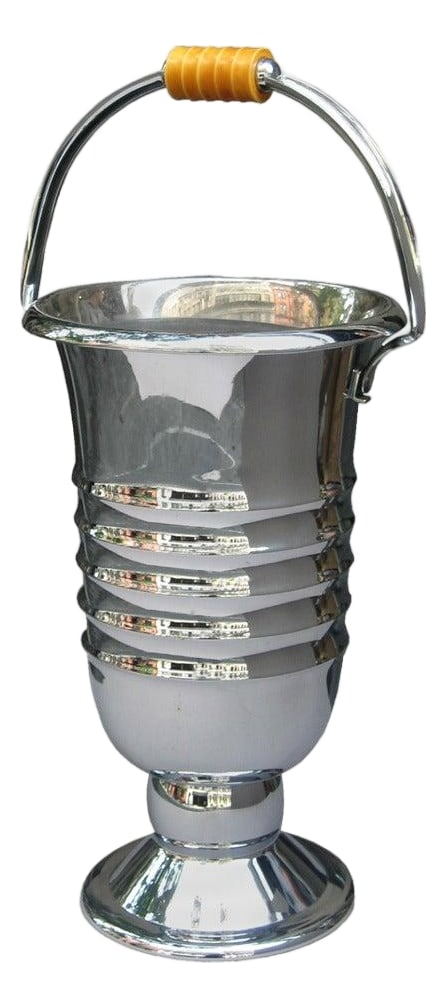 1930s Art Deco Champagne Cooler: An Art Deco period champagne cooler from France circa 1930. The elegant wine bucket is made of nickel plated brass with bakelite handle. The tall body is embellished with a series of concentric rings
