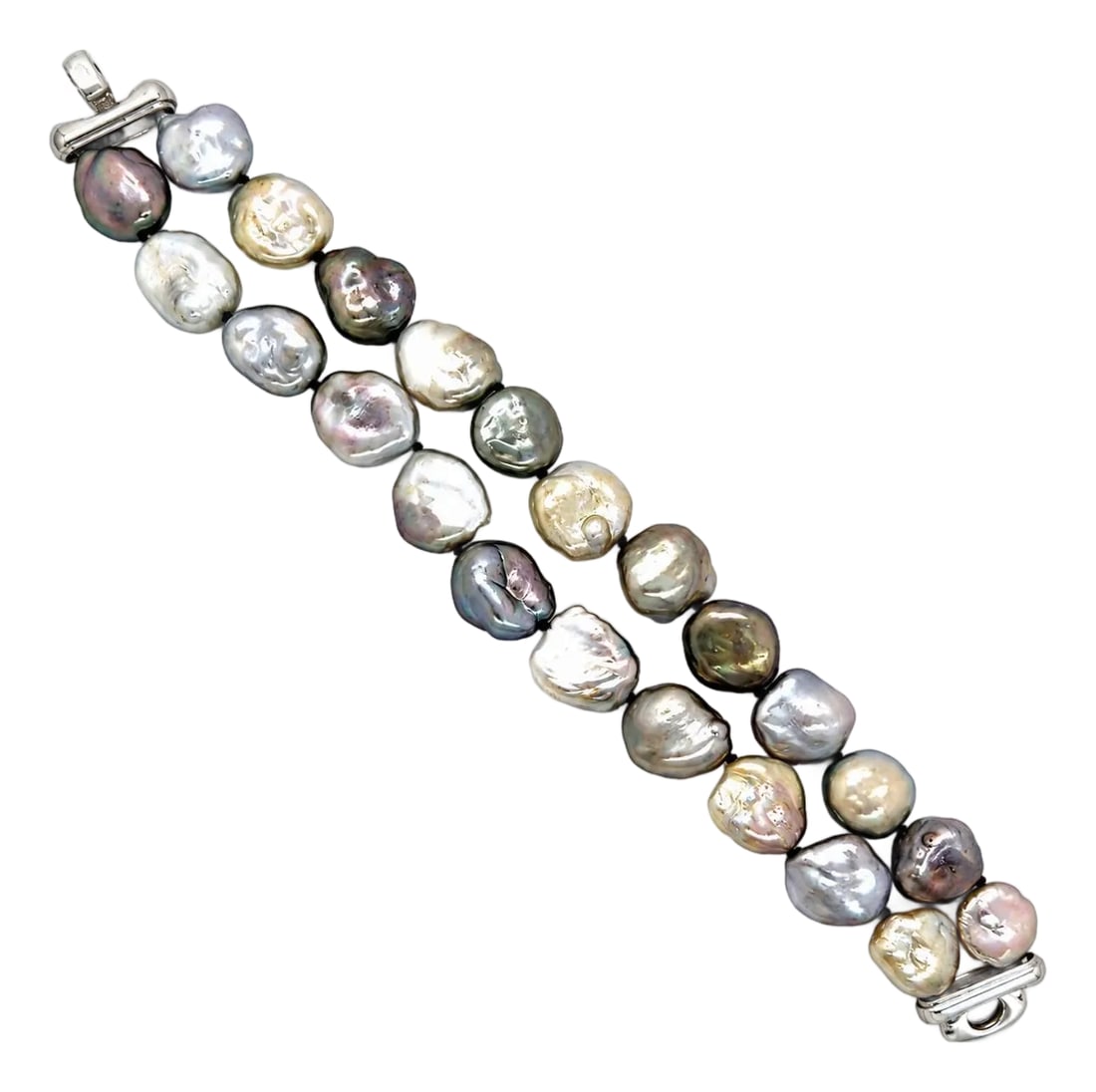 Baroque Tahitian Pearl Bracelet: Double strand bracelet containing twenty-two 11.8mm flat baroque multi color Tahitian pearls. 7.75" long. 14k white gold clasp. 52.36g Condition: Alterations: Original Condition Unaltered