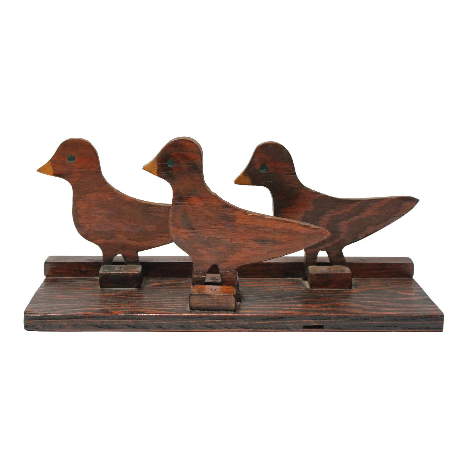 Hand-Carved Folk Art Flock of Baby Ducklings Sculpture: Charming hand-carved wooden trio of ducklings / geese sculpture with hand-painted details (ca. 1950, USA). Patina / wear consistent with and use, as shown. Otherwise, in very good, vintage condition.