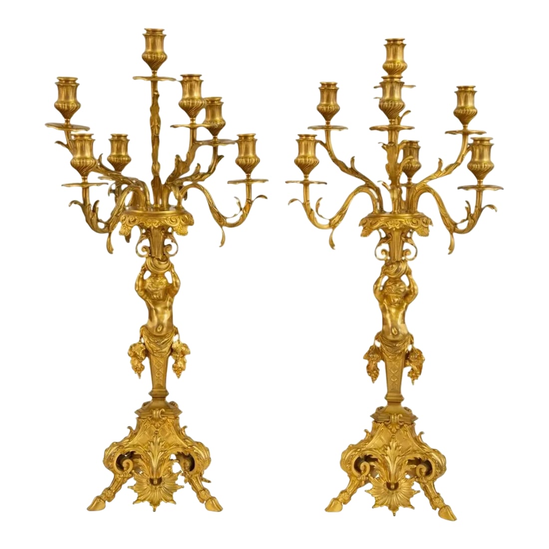 19th C. Pair of Gilt Bronze Figural Seven-Light Candelabra: A Pair of Gilt Bronze Figural Seven-Light Candelabra 19th Century Height 30 1/2 inches. Condition They are likely 19th century but have been much more recently re-gilt. The finish is even and bright