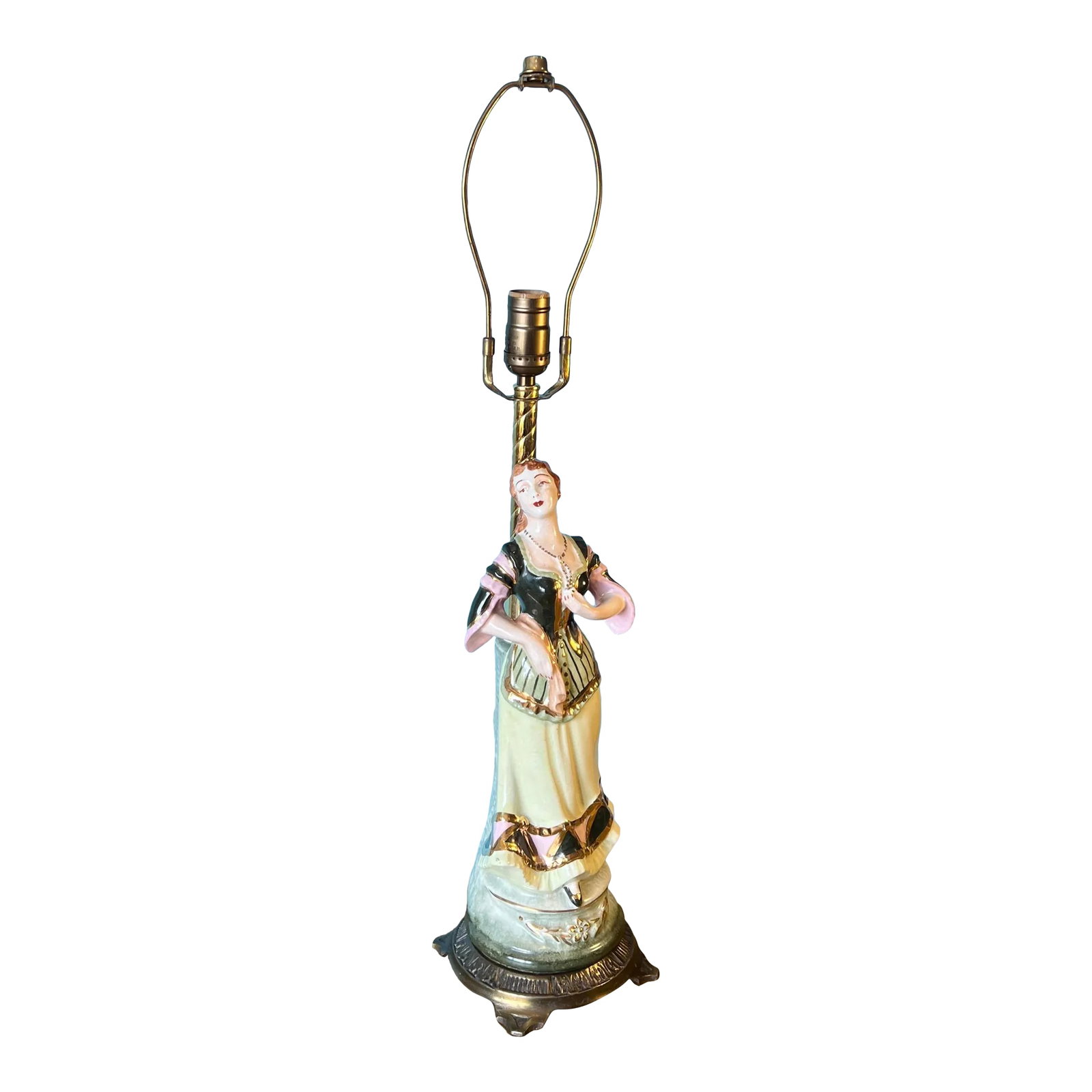 Antique Figural Lady Porcelain Table Lamp: This antique porcelain figural lamp is a captivating representation of a young Victorian lady, evoking a sense of nostalgia and grace. The delicate details bring her to life: her distant gaze with a