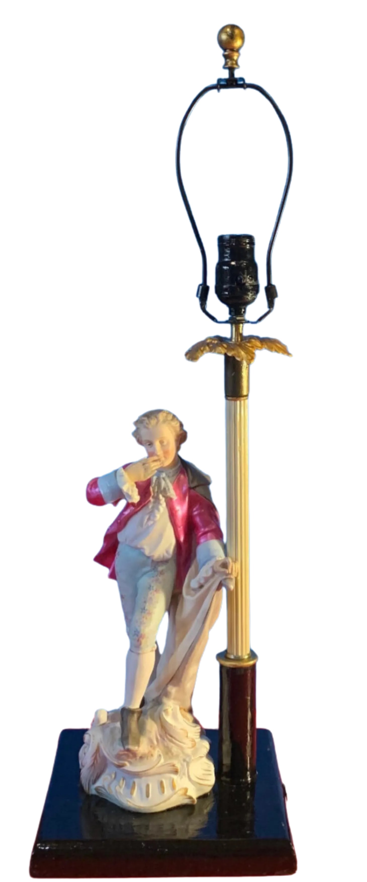 Antique Bisque Porcelain Figural Table Lamp: Young Nobleman: This exquisite antique bisque porcelain figurine, meticulously crafted by skilled artisans in Germany, depicts a young man thoughtfully poised atop a rugged rocky outcrop. Standing at 12 ½ inches