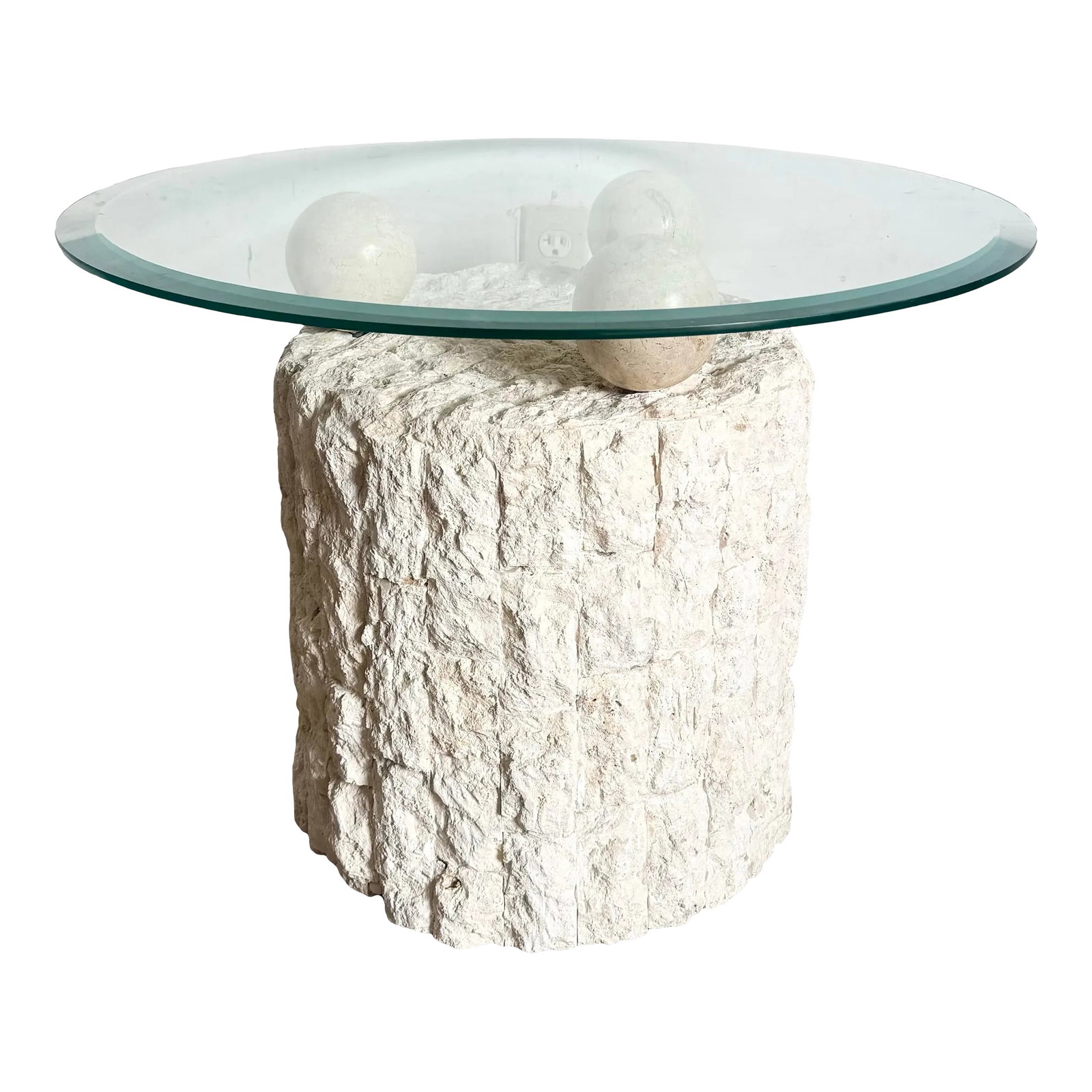 Postmodern Tessellated Stone Circular Beveled Glass Top Side Table: This striking postmodern side table features a circular beveled glass top delicately balanced on tessellated stone spheres, creating a unique blend of natural texture and sleek modern design. The
