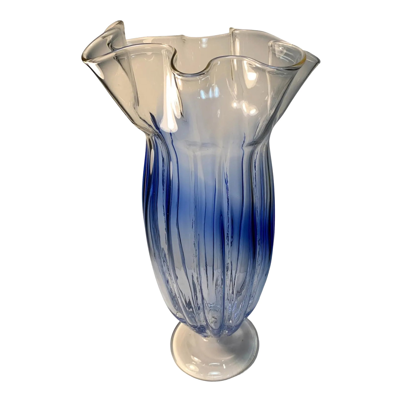 Large Art Glass Blue Ombre Pedestal Vase: This stunning 16 ¼-inch tall art glass vase is a true work of craftsmanship, hand blown by skilled glass artisans using a blend of clear and various shades of blue glass. The vase features a