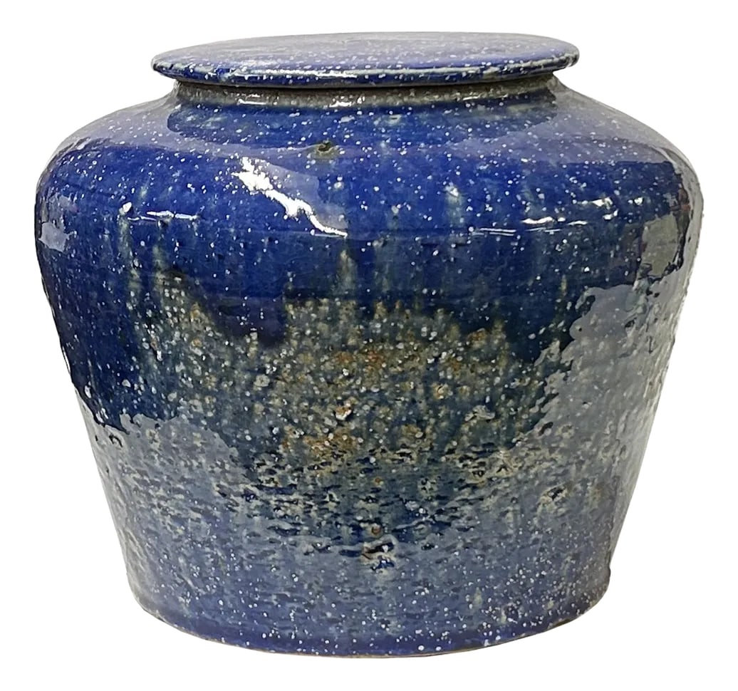 Vintage Distressed Deep Blue White Flecks Round Pottery Pot Jar Urn: This charming ceramic jar captivates with its rustic, handcrafted appeal and striking deep blue glaze. The small, rounded vessel features a slightly tapered base that widens into a smooth, bulbous