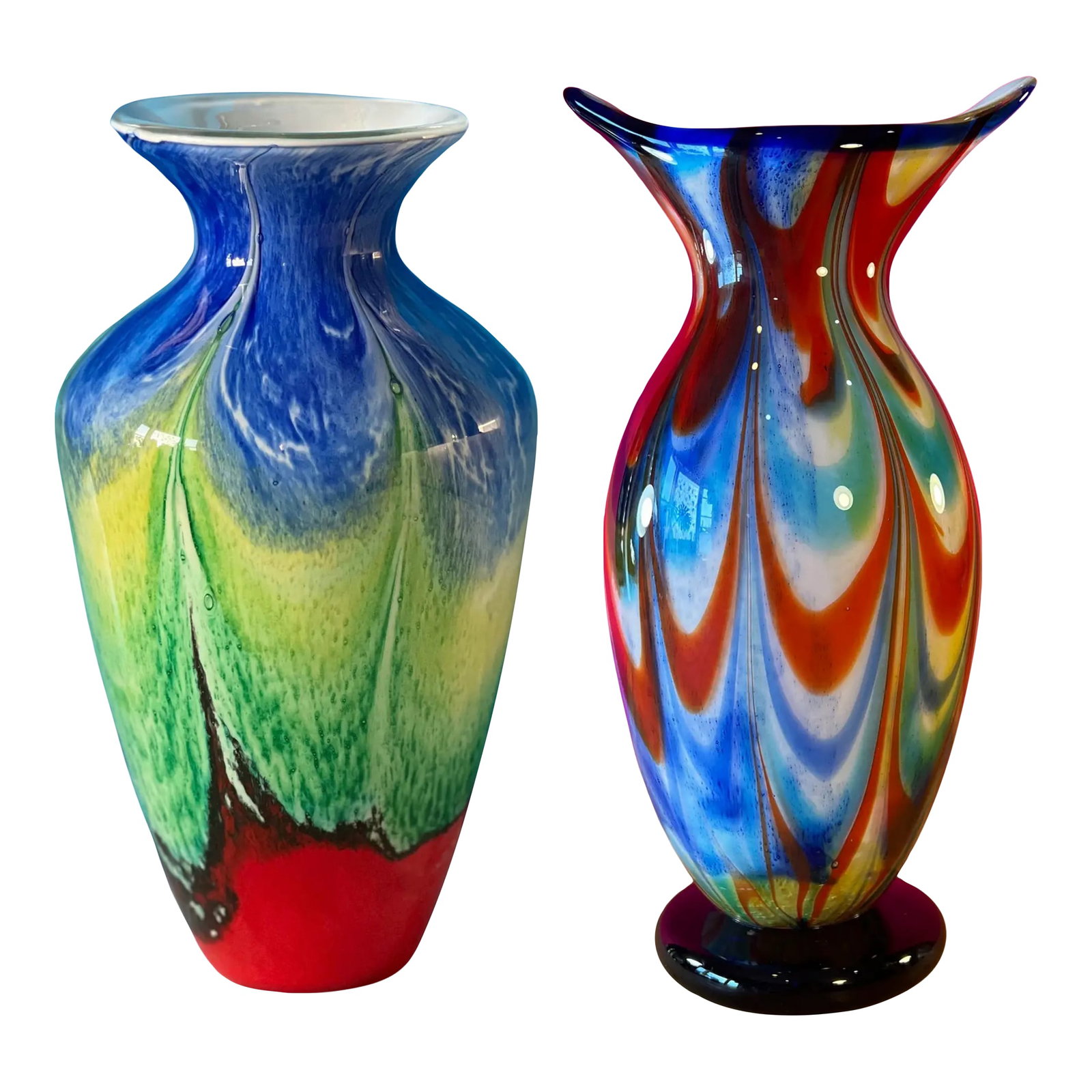 Art Glass Multicolor Vases-a Pair: These hand-blown art glass vases form a striking, harmonious pair—distinct in shape, yet united by the bold, luminous palette they share. Each piece, though sculpted with its own identity,