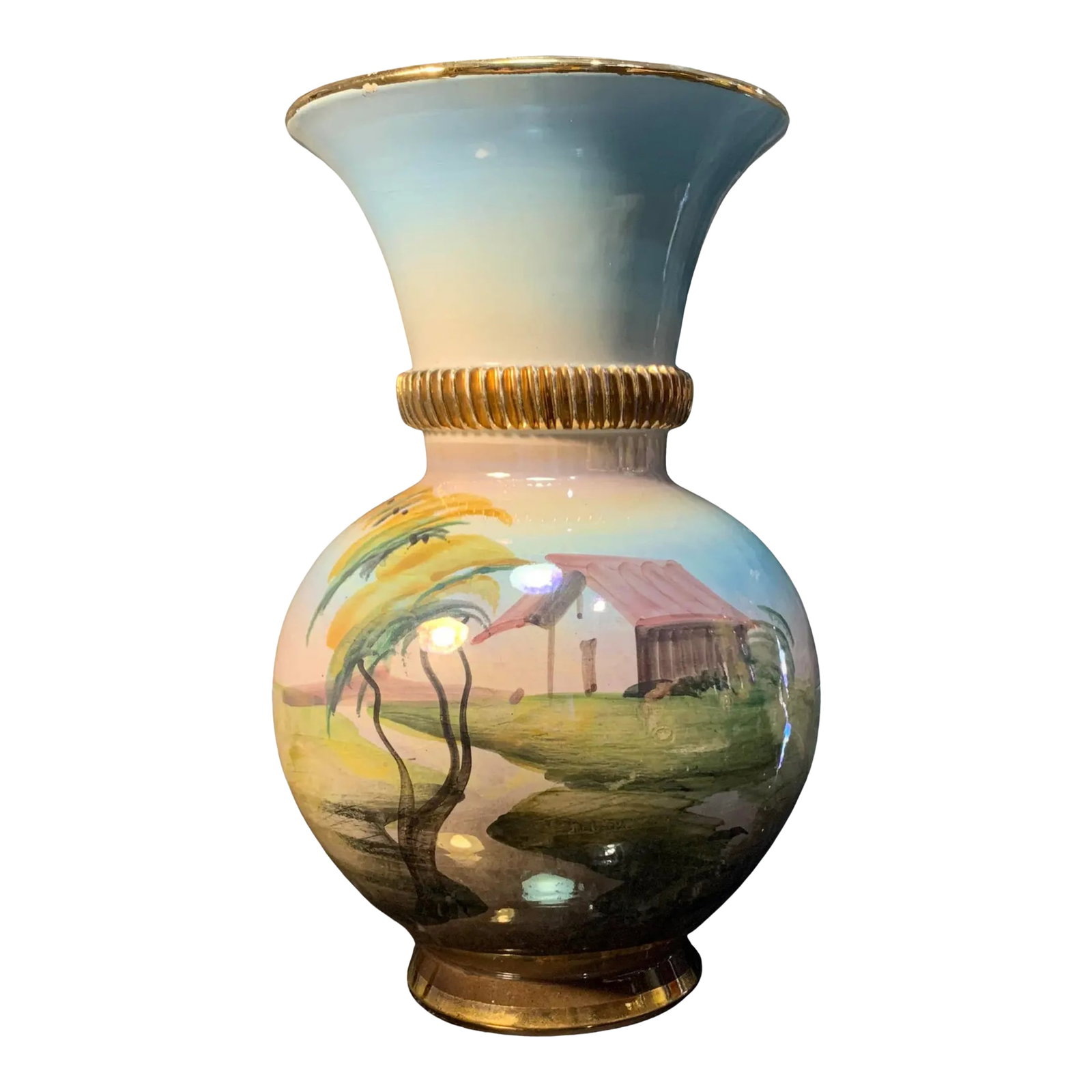 Italian Porcelain Vase Lakeside House: This exquisite 9-inch tall porcelain vase, hand-painted and masterfully crafted by Italian artisans, captures a dual essence of pastoral charm and maritime serenity. Its silhouette is classically