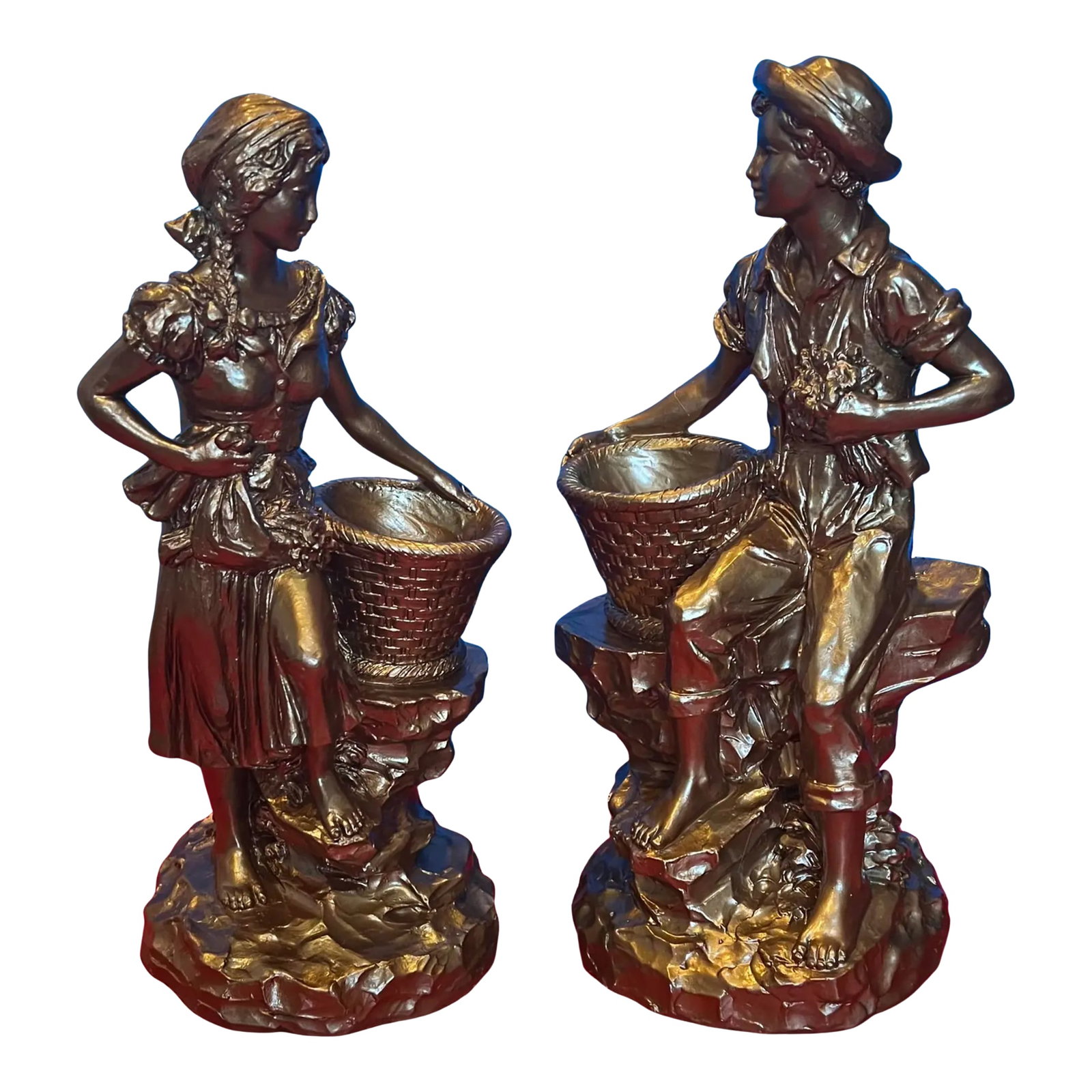 Marwal Village Boy & Girl Holding Baskets - A Pair: Standing just under fifteen inches tall, this mid-century Marwal chalkware sculpture beautifully portrays a barefoot village boy and girl pausing from their harvest to rest on a cluster of rocks.
