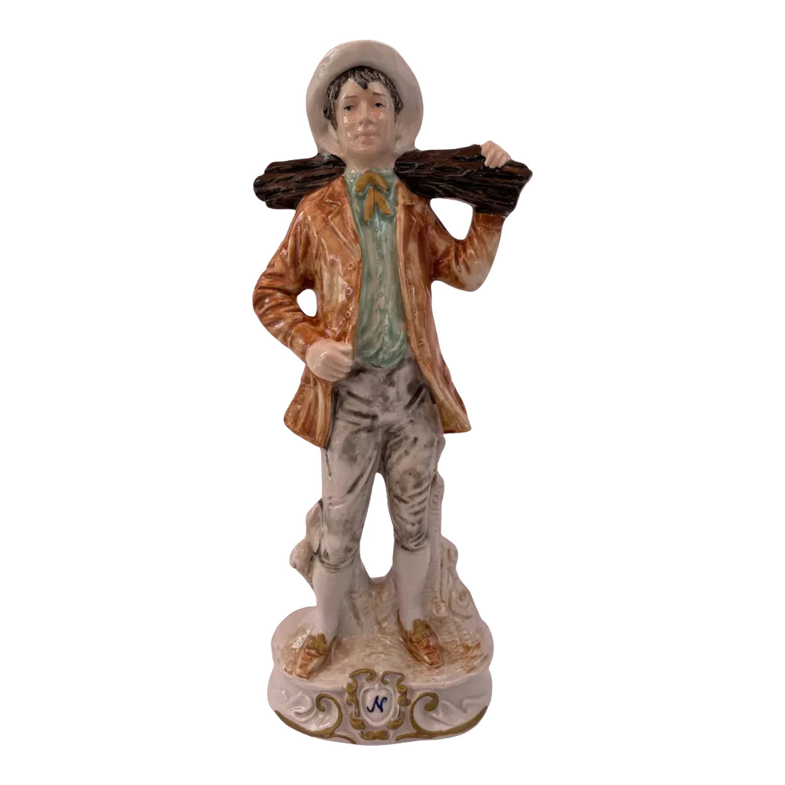 MId-Century Capodimonte Porcelain Man Carrying a Log: This 12½- inch Capodimonte porcelain figurine captures the rustic charm of a young man in motion, carrying a log over his shoulder. His attire—a wide-brimmed hat, an orange-brown jacket, a