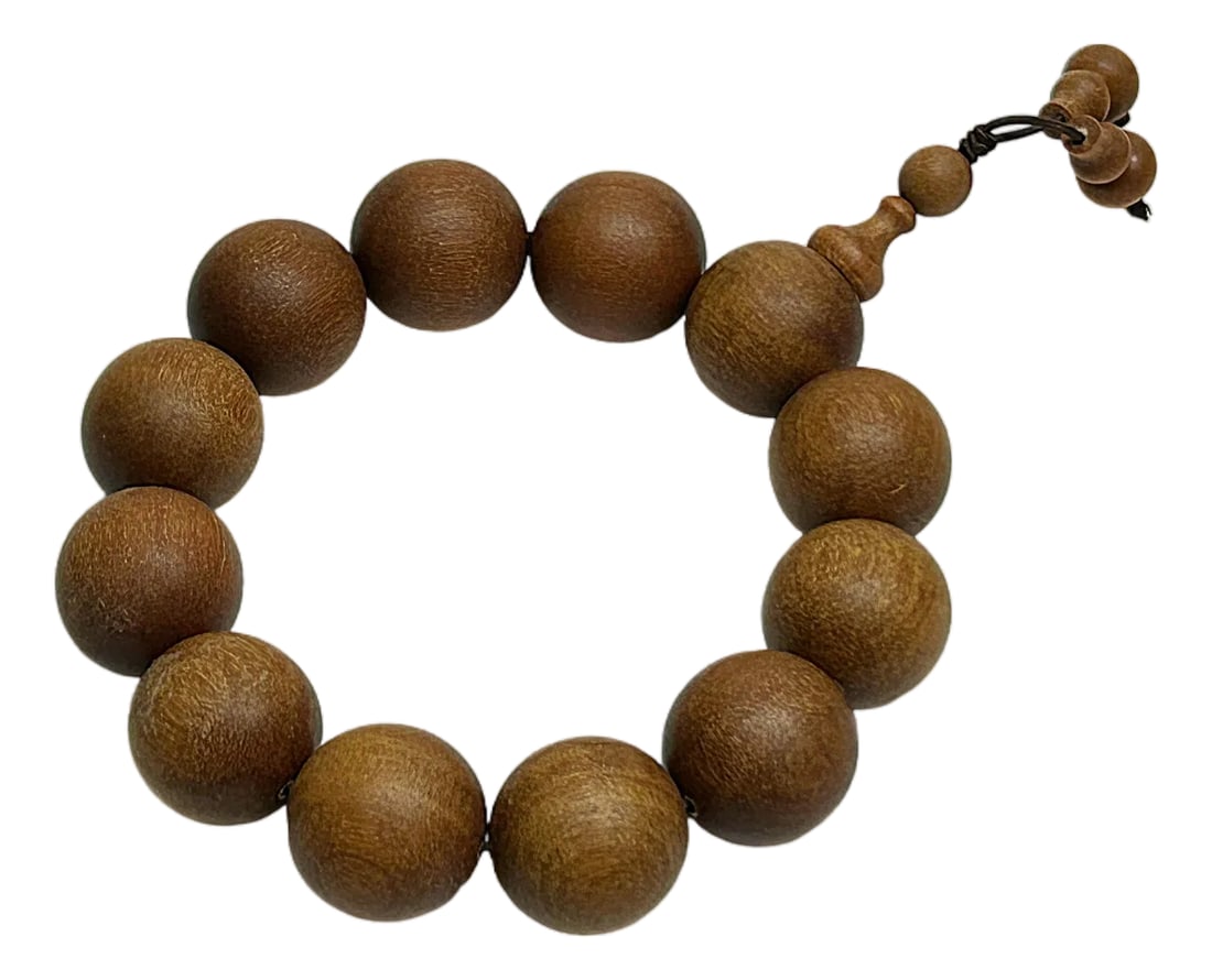 Chinese Brown Sandalwood Beads Hand Rosary Praying Bracelet: Embrace a tangible connection to your faith with our handcrafted prayer bracelet. Each bead, meticulously carved from natural wood, serves as a gentle guide and a beautiful reminder to pause,