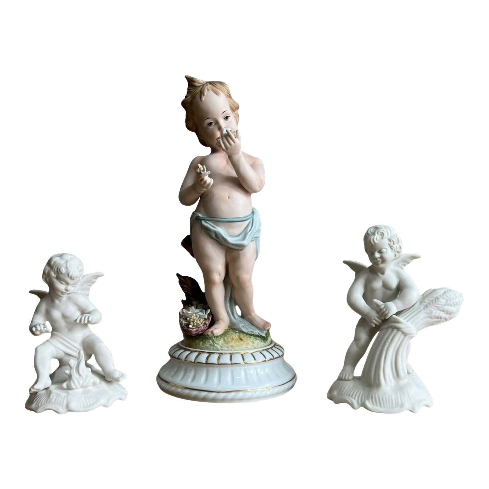 Mid-Century Dresden Bisque Cherubs and Young Child - A Set: A captivating trio of mid-century bisque porcelain figurines, exuding a harmonious blend of Eastern and Western artistic sensibilities. At the heart of this enchanting scene stands a young child, 11