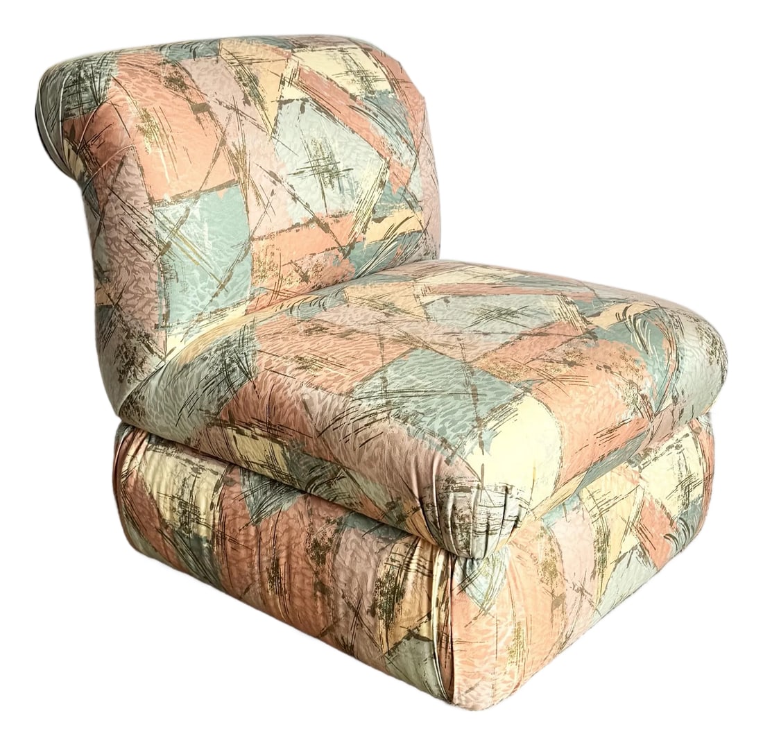Postmodern Sculpted Upholstered Flared Lounge Chairs: These sculptural postmodern lounge chairs embody the expressive design language of the late 20th century, defined by their bold, flared silhouettes and softly rounded forms. Upholstered in an