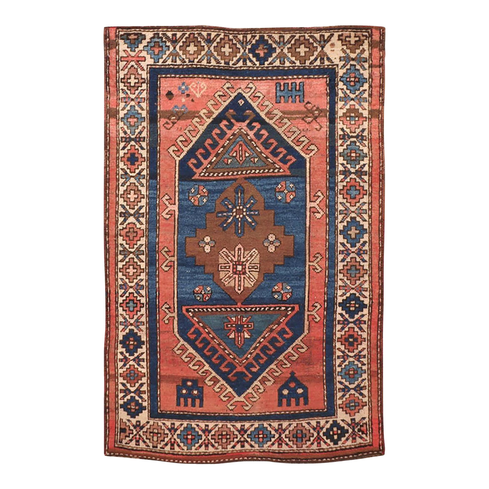 Galerie Shabab Collection Early 20th Century Turkish Anatolian Throw Rug: This early 20th century Turkish Anatolian rug, measuring 3' 1" x 4' 7", showcases a bold geometric medallion design rendered in a striking palette of indigo, brick red, ivory, and chocolate brown.