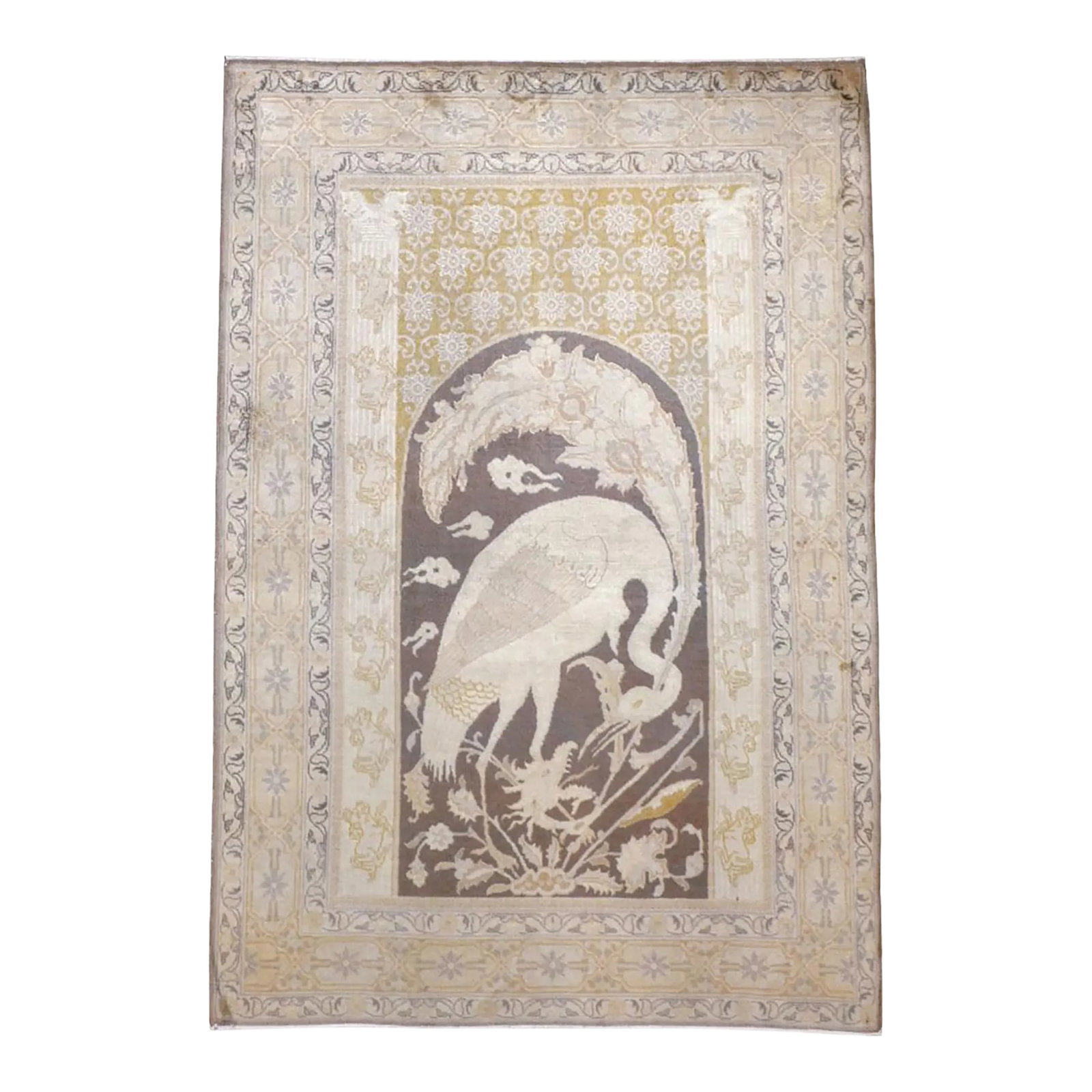 Galerie Shabab Collection Early 20th Century Persian Tabriz Pictorial Rug: The brown arch topped field displays a crane confronting a dragon head emerging from a flower clump at the base of this antique oriental rug. Cloud wisps fill the background. A textile repeat pattern 