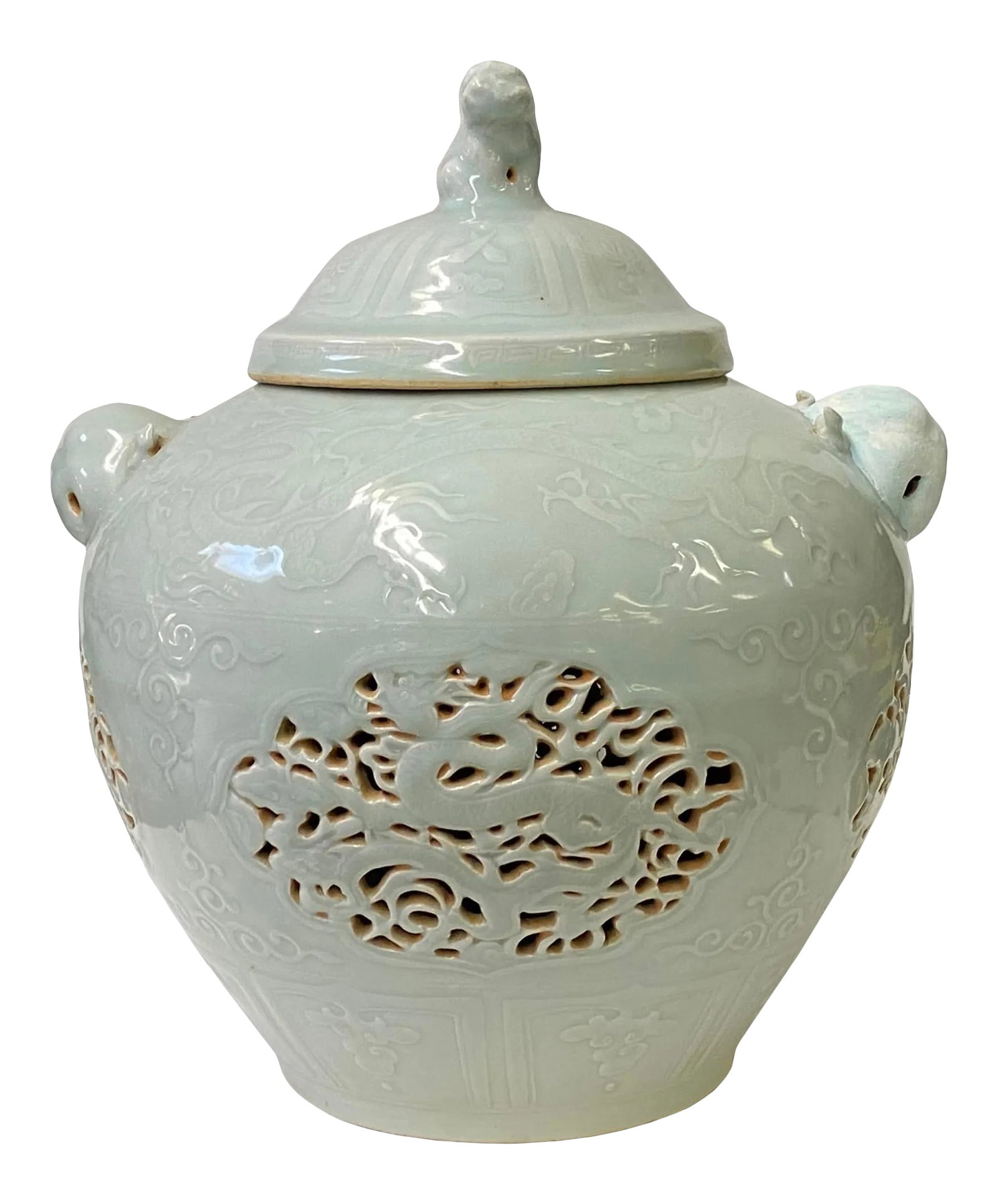 Chinese Off White Light Celadon Porcelain Dragon Foo Dogs Jar Container: This is an oriental Chinese round shape porcelain container with an off-white light celadon base color. There is a fade pattern on the glaze. Relief sees through dragon pattern is on the body. Dimensi