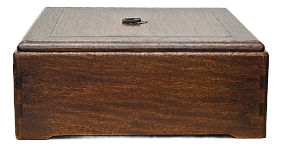 Oriental Plain Surface Brown Natural Wood Small Square Accent Box: This elegant storage box is crafted from solid wood with a rich, warm brown finish that highlights the natural beauty of its grain. It features a clean, square silhouette with a slightly recessed lid,