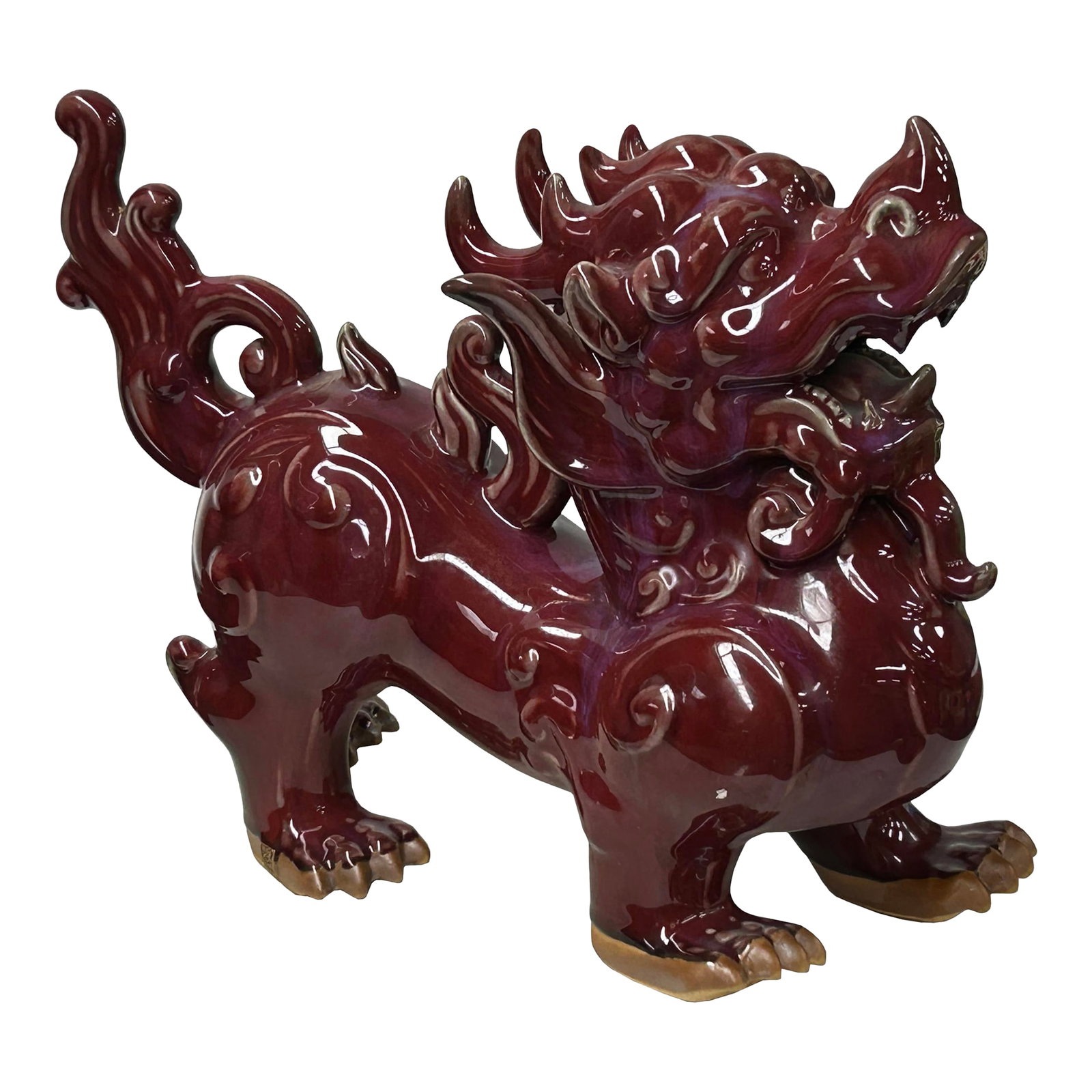 Chinese Artistic Purple Red Oxblood Color Glaze Ceramic Fengshui Pixiu Figure: This striking ceramic sculpture depicts a Pixiu (or Bixie), a mythical Chinese protector creature, rendered in a deep, lustrous oxblood glaze. The figure is captured in a powerful, standing stance, bl