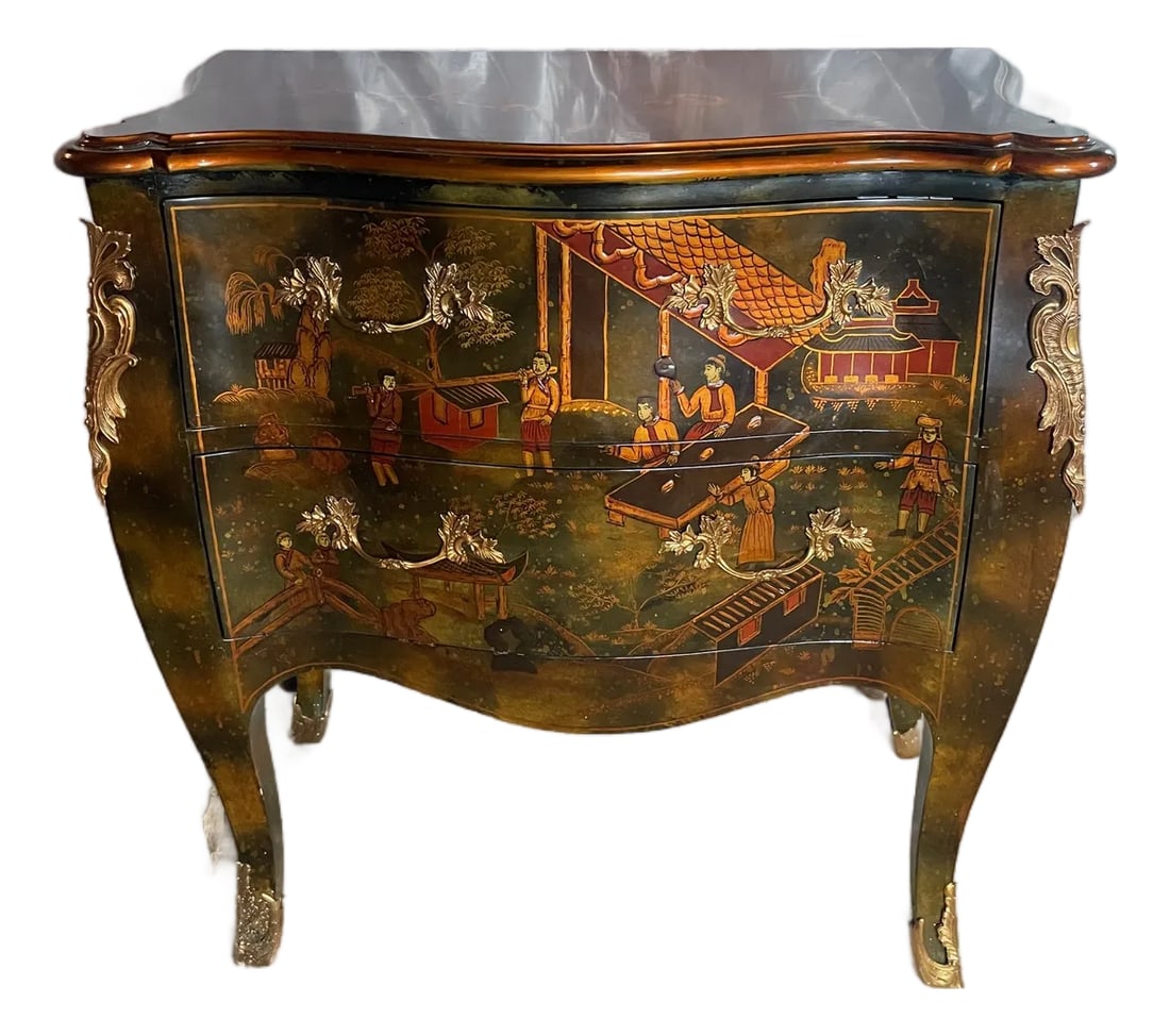 Chinoserie Bombe Chest: A small size Louis XV style bombe chest decorated in Chinoiserie style lacquer by Maitland- Smith furniture. The chest is an unusual blend of mottled black, green red and orange lacquer rendered to ap