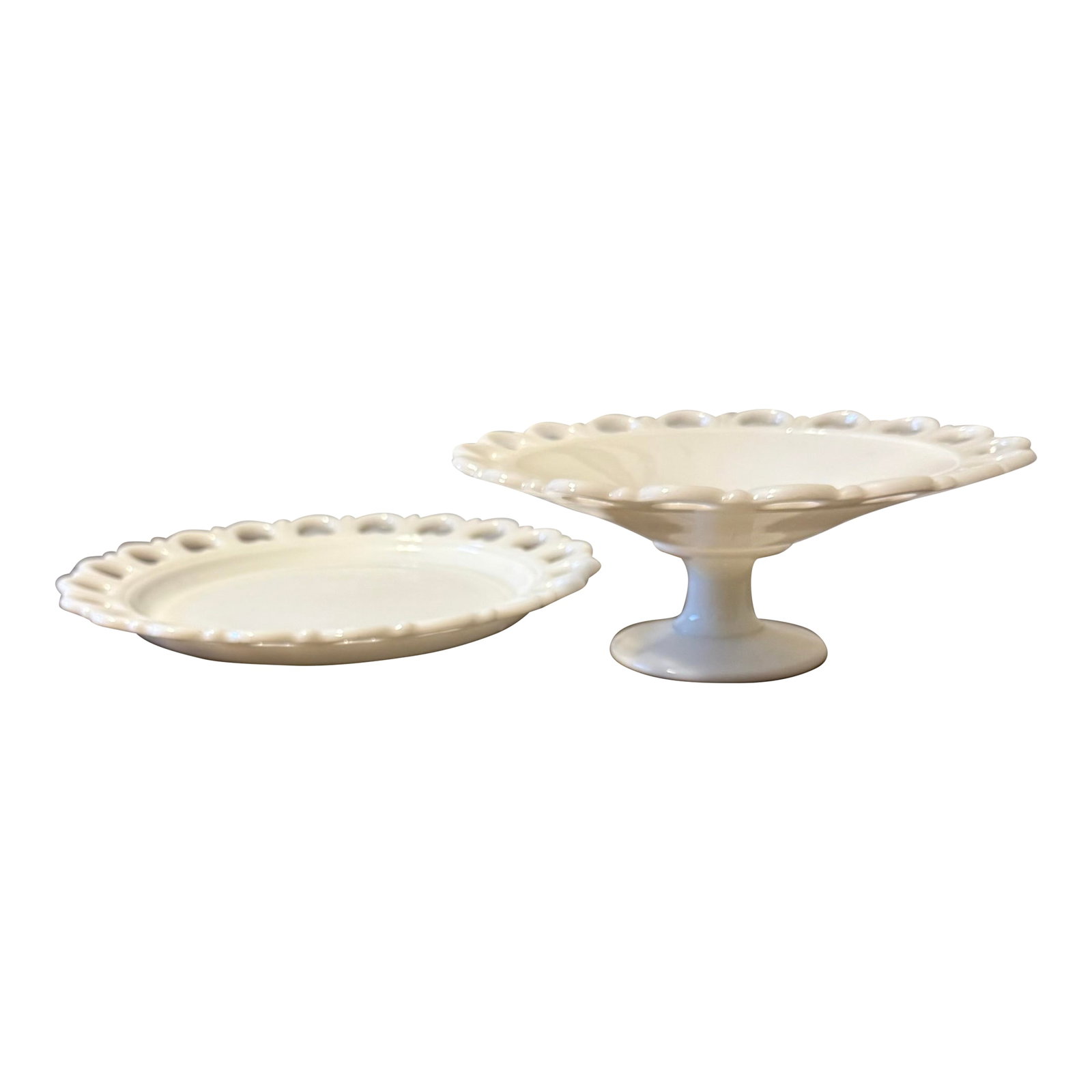 Anchor Hocking Milk Glass Lace Edge Serving Set: These pieces are cherished for their elegant simplicity and functionality, suitable for serving desserts, appetizers, or as decorative display items embodying a timeless charm that complements