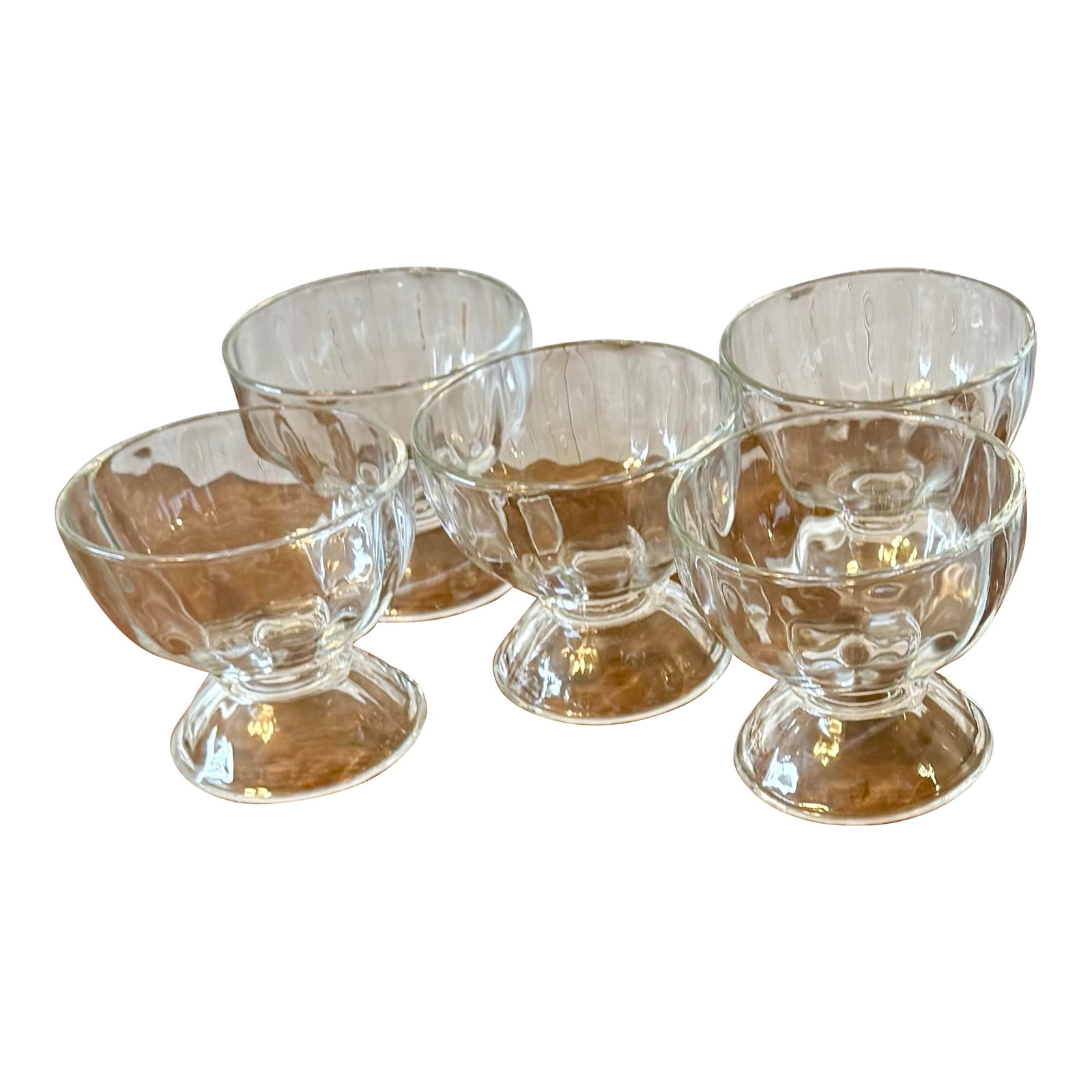 Libbey Glass Pedestal Bowls - Set of 5: This is a set of five charming vintage dessert bowls featuring a ribbed or optic pattern on their side with a footed base. These bowls are ideal for serving individual portions of desserts such as