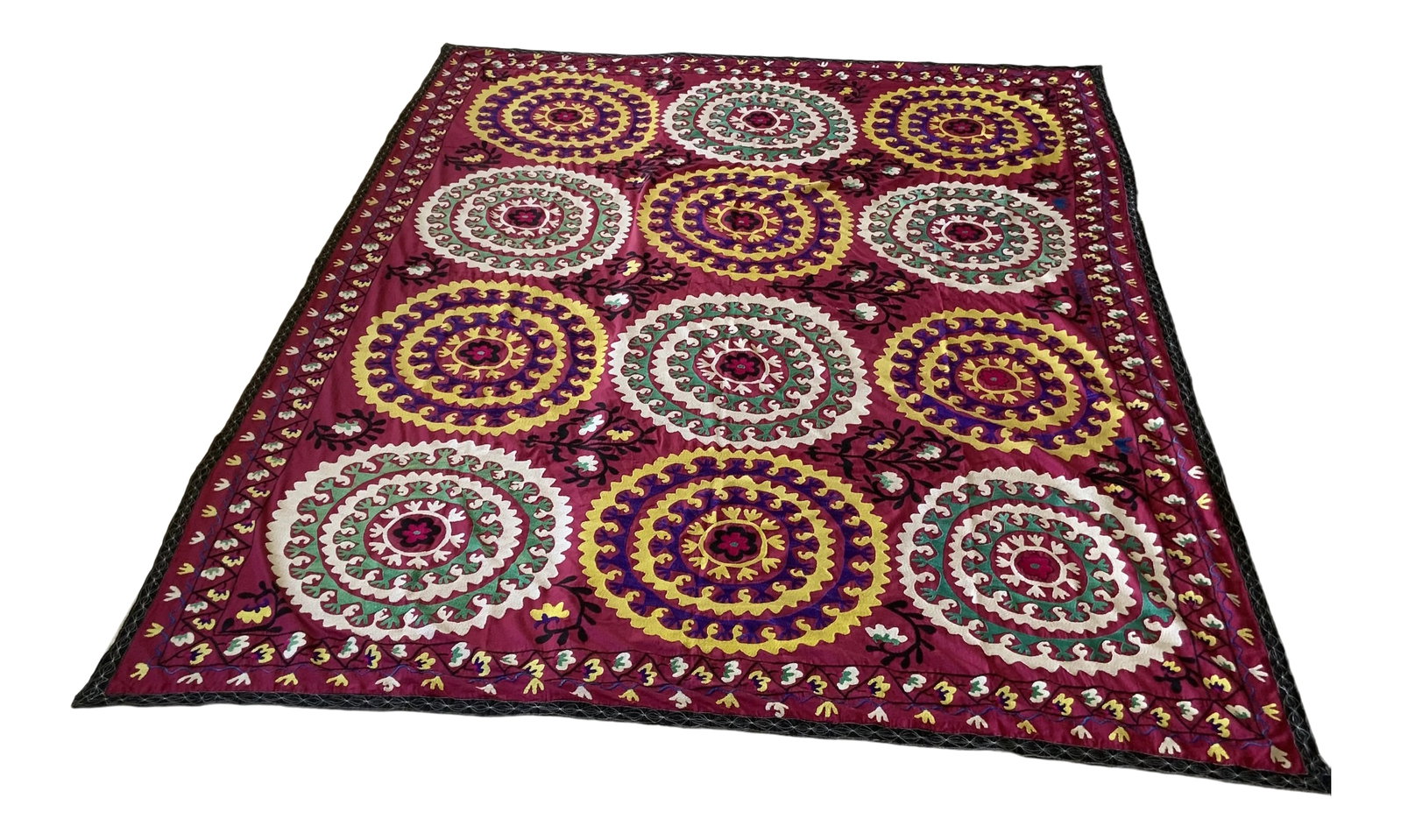 Antique Signed Hand-Embroidered Large Suzani Textile: Antique gorgeous large scale suzani in vibrant hues of raspberry red, teal green, white, yellow and black. Suzani measures 120 " x 87". Signed in blue stitching. Purchased in Copenhagen. Condition: