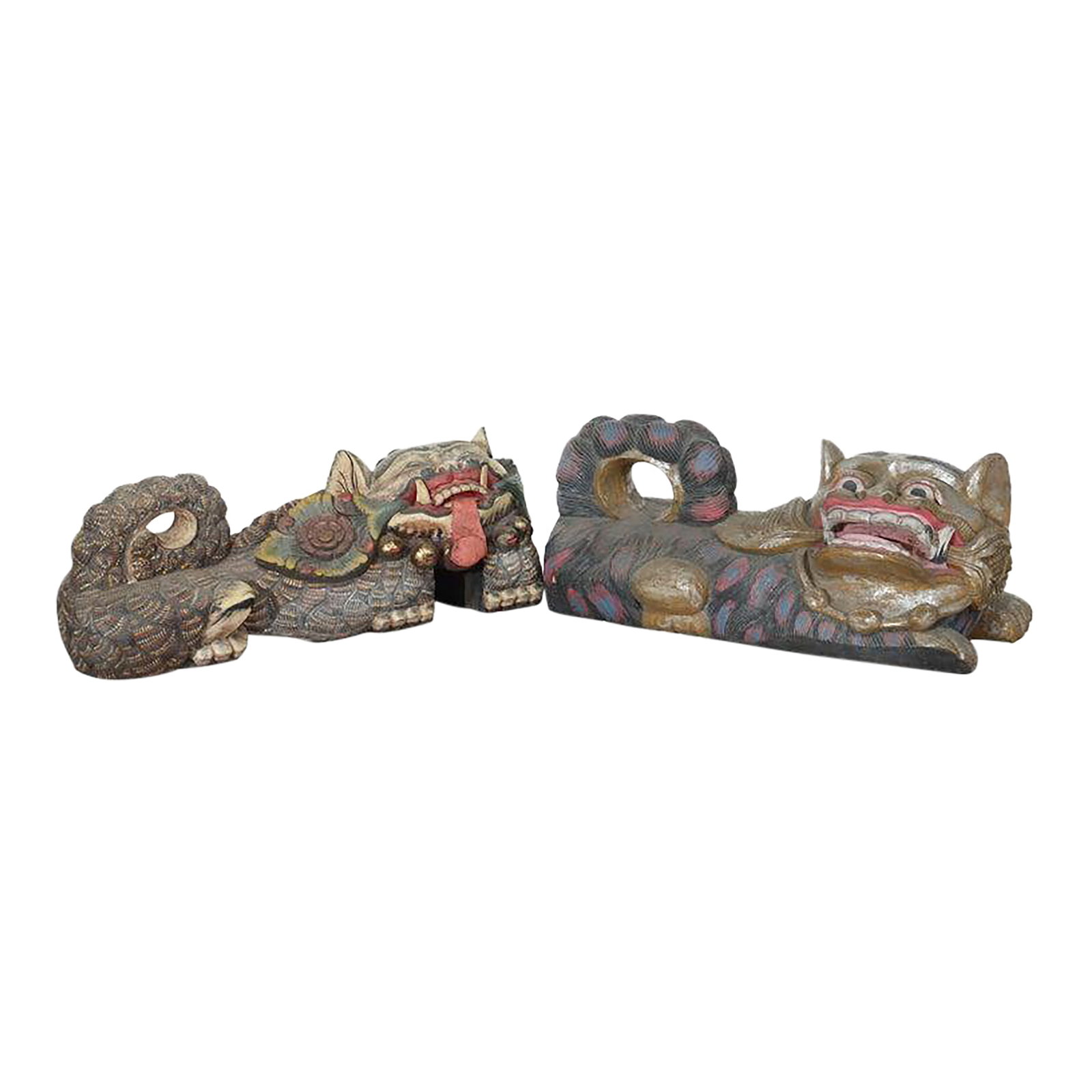 20th Century Large Chinese Polychromed Carved Wood Foo Dogs - a Pair: A distinguished pair of Chinese carved wood Foo Dogs, dating to the 20th Century, presents a captivating example of traditional Asian decorative art. These guardian lions are meticulously hand-carved 