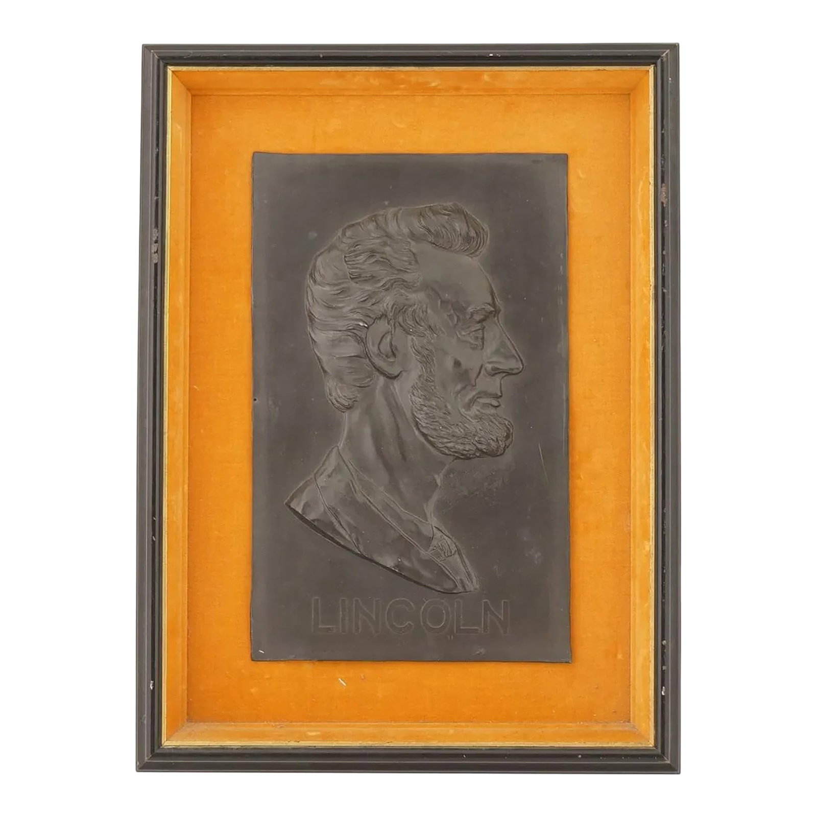 American President Lincoln Portrait Plaque Framed: An American metal plaque depicting a relief portrait of Abraham Lincoln designed by sculptor and medalist Victor David Brenner. Inscribed, Lincoln, lower to the center. Framed. Brenner used an 1864