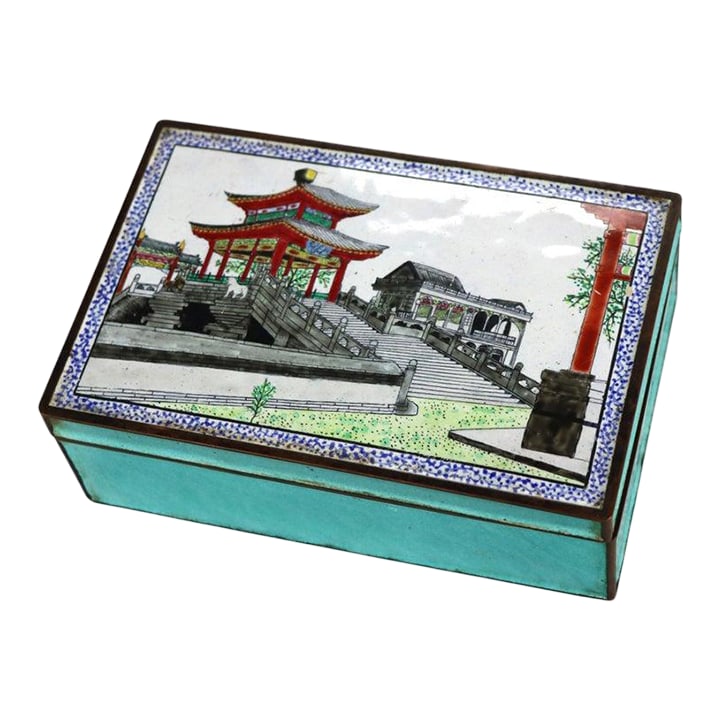 Chinese Scenic Cloisonne Enameled Jewelry Box Unsigned C1930: An exquisite antique Chinese cloisonné enamel jewelry box, dating to approximately C1930, presents a captivating scenic depiction on its lid. The rectangular box is meticulously crafted with a