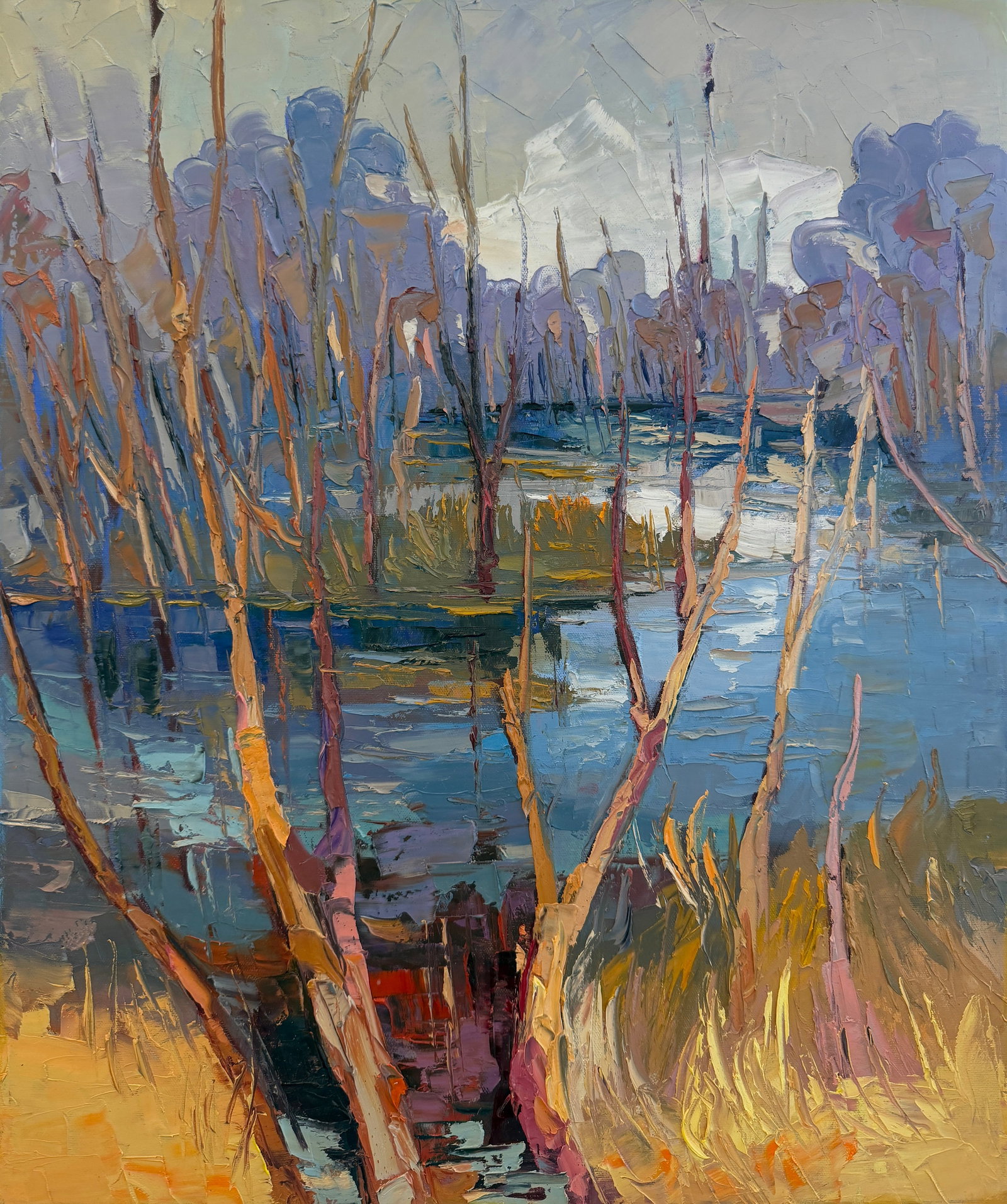 Before the Leaves Return by Godfrey Afebuame, Oil on Canvas (2026) Impasto: I created Before The Leaves Return to capture the quiet beauty of the landscape just before spring begins. This painting shows a group of bare trees standing in front of blue water. I used very thick