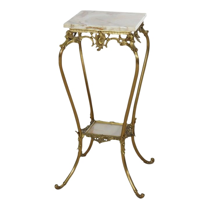 Rococo Gilt Bronze & Onyx Plant Stand C1910: This antique plant stand, dating to circa 1910, features a finely crafted gilt bronze frame supporting two polished onyx tiers. The design incorporates ornate Rococo Revival elements, including