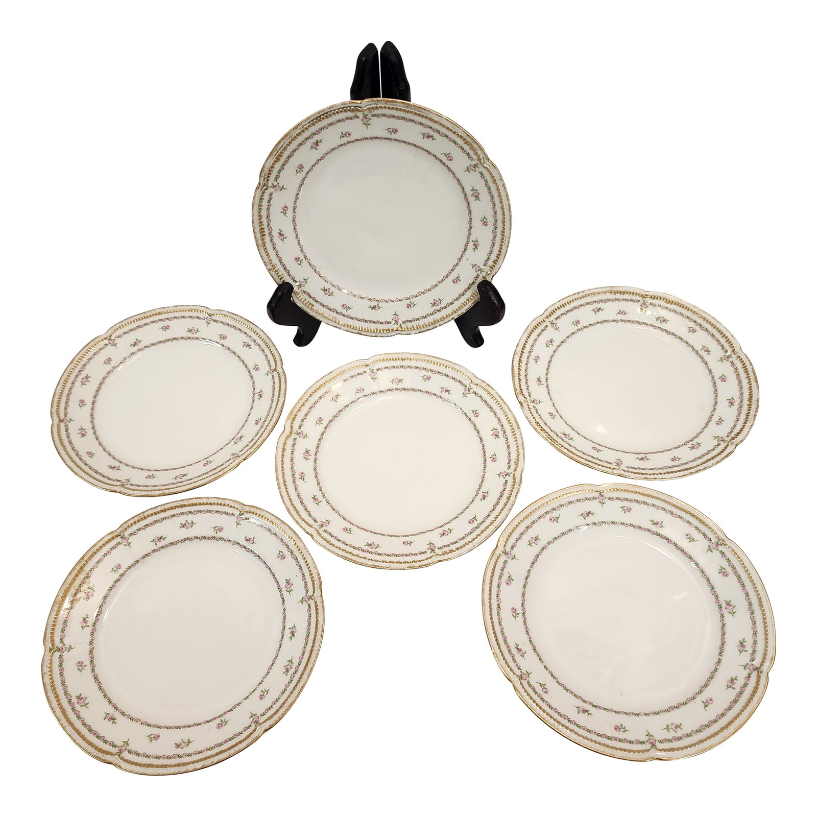 1930s Set of 6 Gda Limoges Dessert Plates From France: This set of 6 Limoges Goa Bruxelles dessert plates boasts a delicate rose pattern and fine gold edge. Condition: Alterations: Original Condition Unaltered Imperfections: Some Imperfections Condition