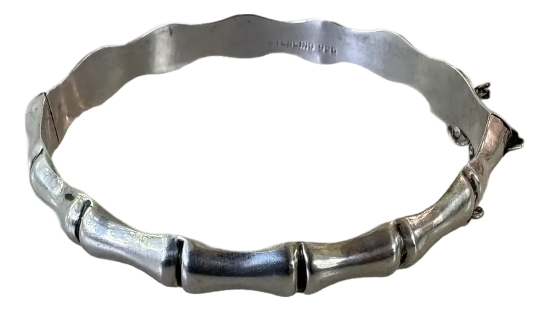 1980s Sterling Silver Bamboo Hinged Bangle Bracelet: Chic vintage sterling silver bamboo bangle bracelet with hinge clasp. Condition: Alterations: Original Condition Unaltered Imperfections: Some Imperfections Condition Notes: Excellent condition