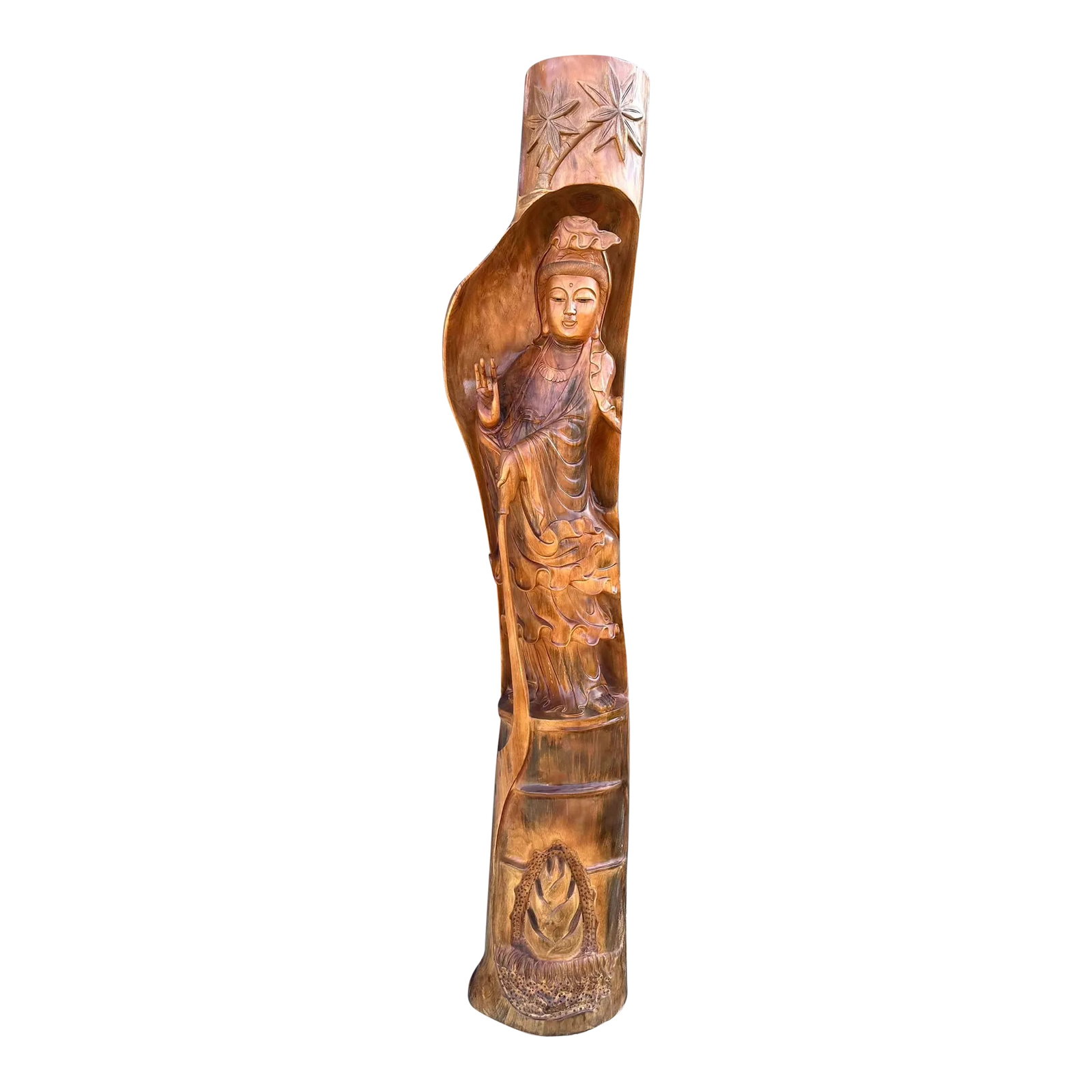 Large Guanlin Carved Wood Statue: Large Guanlin wooden statue carved from a single tree. The front is a wood carving of a bodhisattva with a couple of carved flowers above and a carved lotus below. It is finished in front, while the