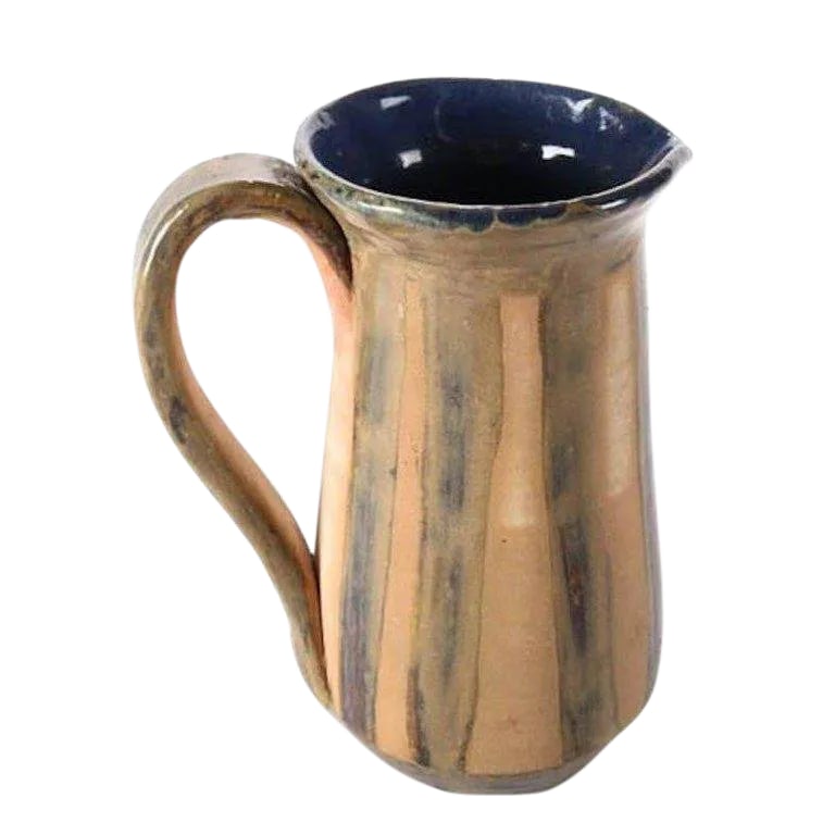 Mid-Century Modern Hand-Thrown and Glazed Studio Pottery Pitcher: Mid-Century Modern hand-thrown studio art pottery pitcher features striped exterior with cobalt blue glazed interior, mid 20th century Provenance: Deaccessioned from the Call Museum, Hartsville, New Y