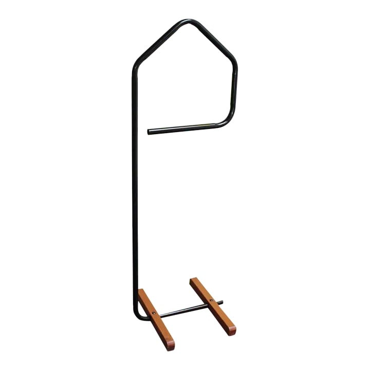 American Postmodern Black Tubular Metal Valet/Dress Boy: American Postmodern black metal valet supported by maple bases by Kinnovations (1981, Dallas, TX). Original condition with only light scuffs to the black paint. Retains the 'Kinnovations'
