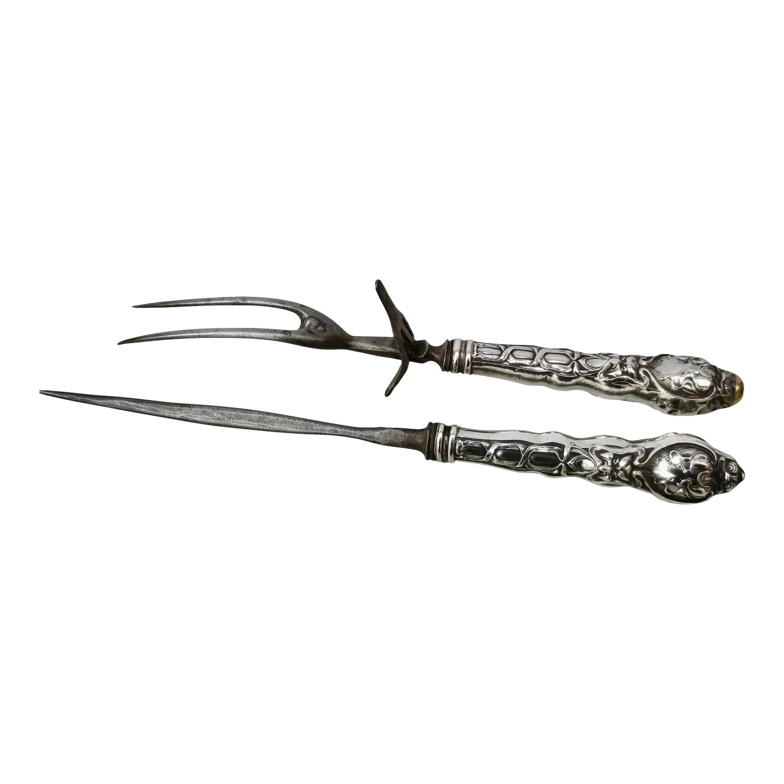 Art Nouveau Steel Carving Set - a Set of 2: Art Nouveau steel carving set. Sterling silver handles with terrific art nouveau design of long flowing ribbons covering and blending with grotesque faces. Extreme Nouveau tendrils and braiding of