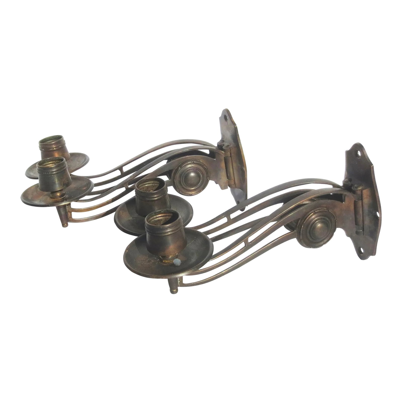 Pair of Art Deco Bronze Piano Sconces Circa 1930s - Pair of 2: Art Deco piano sconces with hinged arms and candle cups. High-style art deco graphic design. Long scrolling arms with a design reference to sheet music. Candle cups with wide bobeche cups, the back
