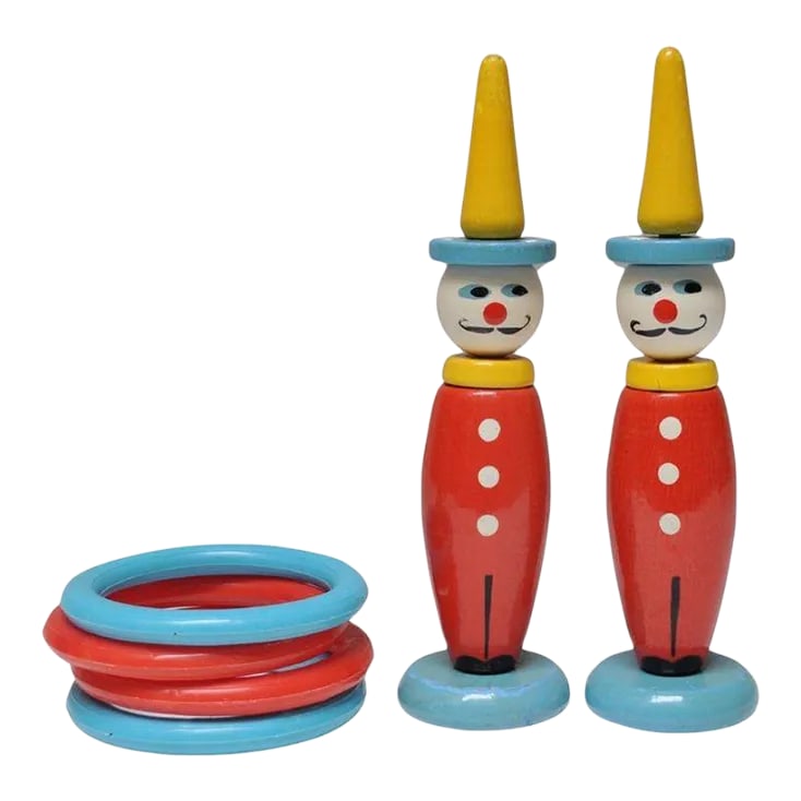Pair of Vintage French Painted Wooden "Clown" Skittles / Ring Toss Stands With Rings: Delightful pair of circa 1950s French clown skittles / ring toss stands with the original four rings. Vibrant colors of sky blue, yellow and red with patina / losses consistent with age and use (paint