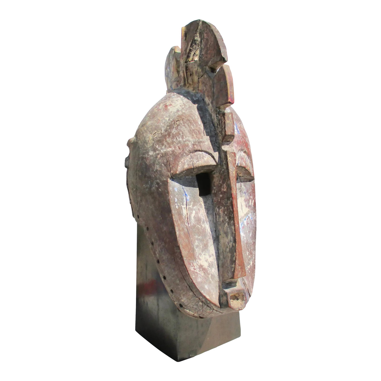 Antique African Fang Tribal Mask From Gabon, Cameroon: Antique African tribal wood mask from the Fang tribal group. Central equatorial Africa. Carved from one piece with holes along the bottom edge for raffia attachments. Traces of polychrome remain in va