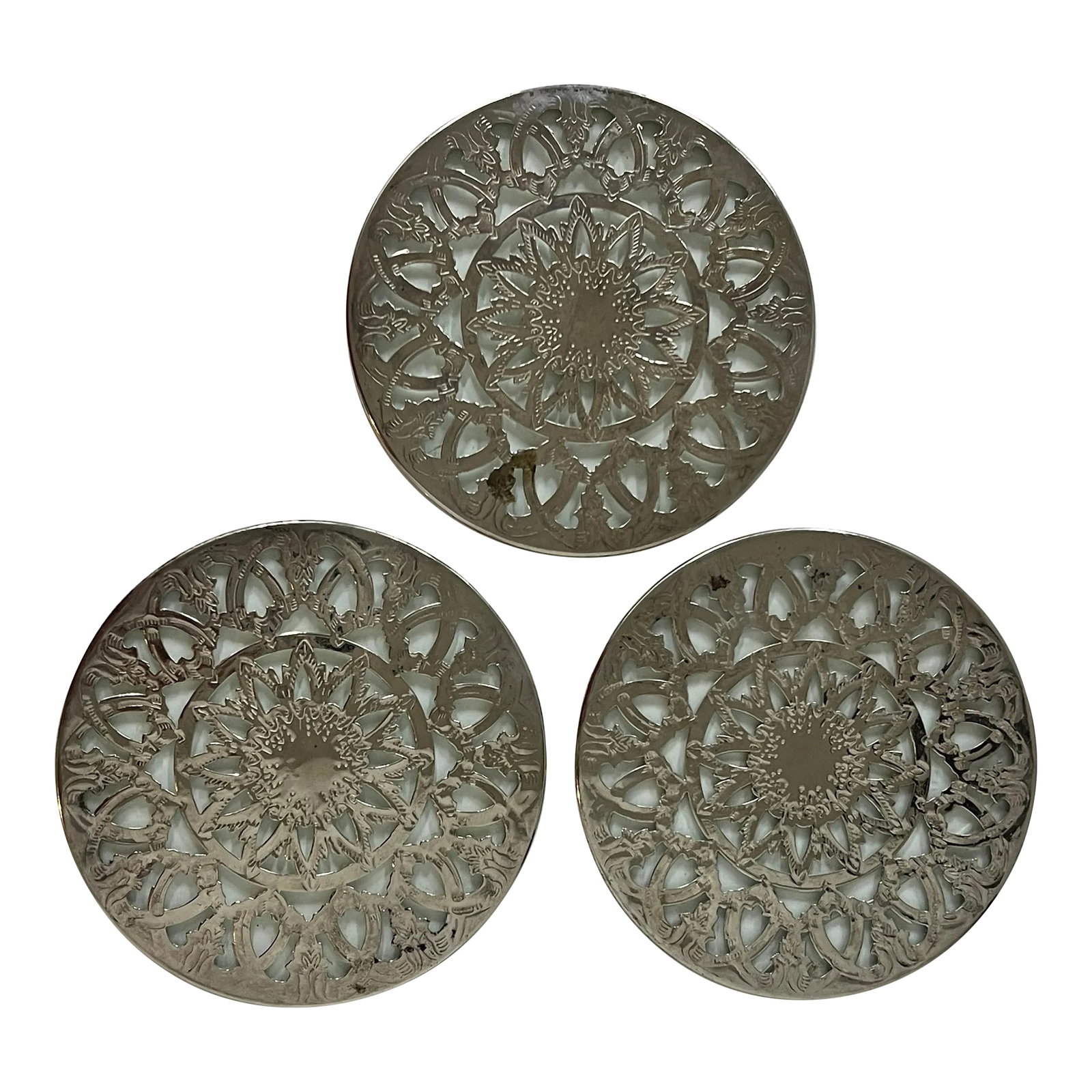 Mid Century Silverplate Round Reticulated Trivet - Set of 3: Set of 3 vintage silverplate reticulated trivets. Each has glass reinforcing the design. One has a crack in the glass but remains firmly in place. Each measures 6" diameter x 1/8" thick. Condition: